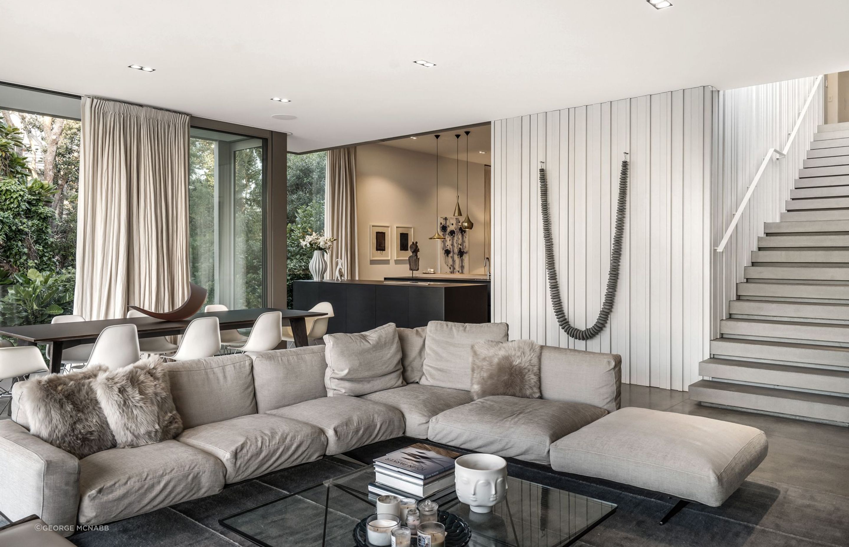 The house is clearly arranged around a central core and staircase, making the spaces seem open and welcoming.