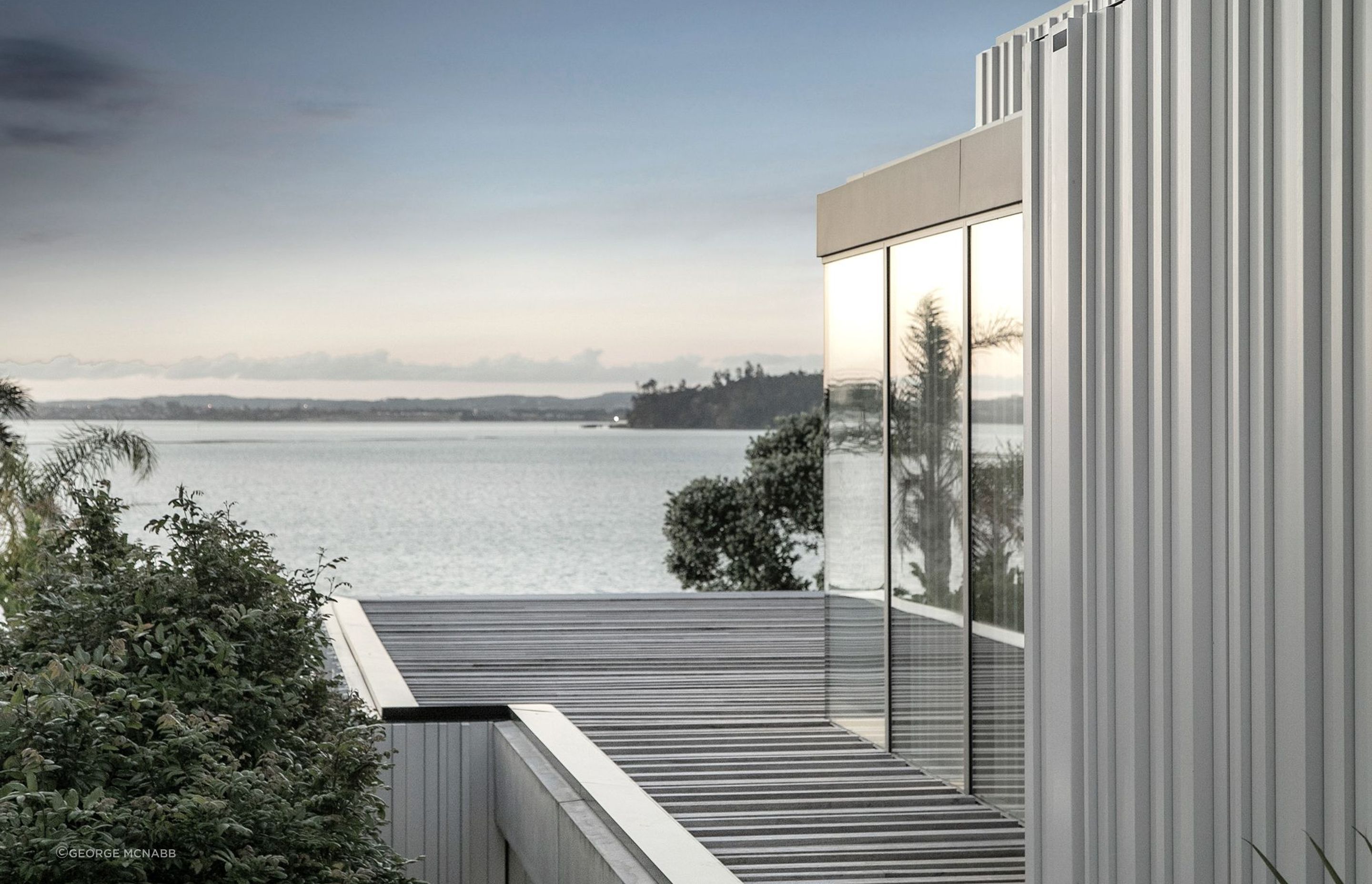 A harbour view across to Auckland's North Shore can be seen from the upper level of the house.