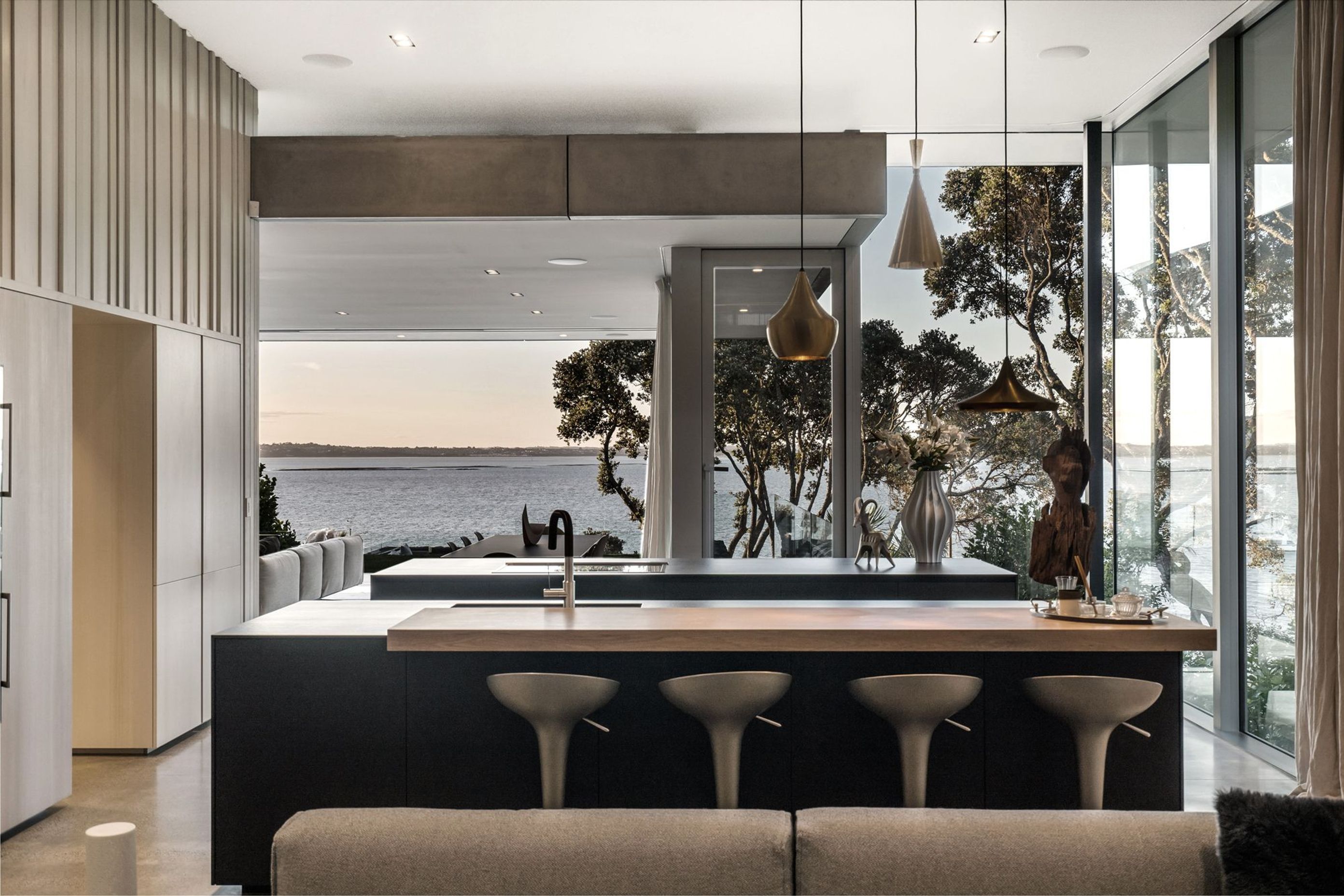 The large kitchen and scullery is a cook's paradise, with ocean and bush views on two sides.