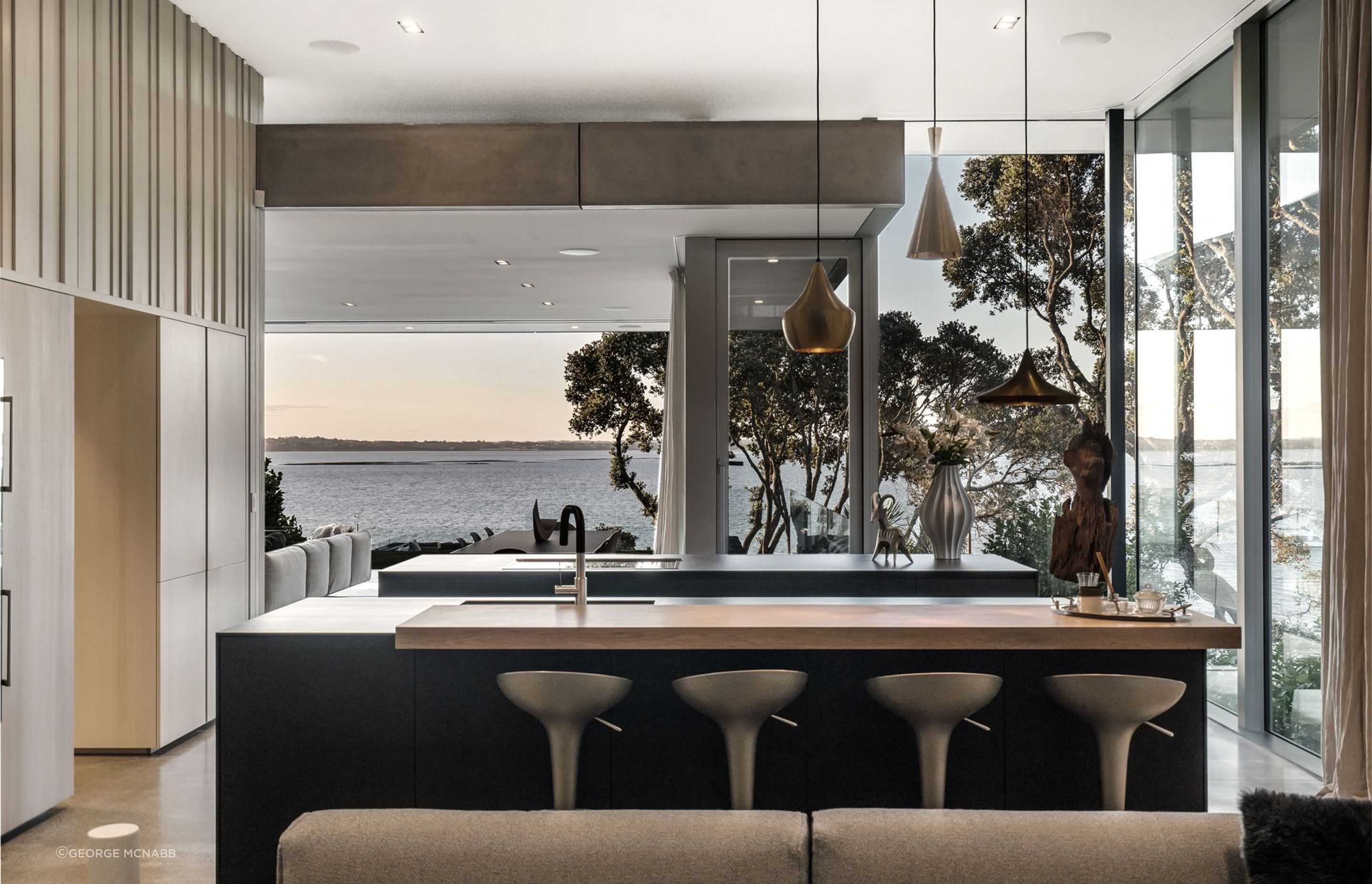 The large kitchen and scullery is a cook's paradise, with ocean and bush views on two sides.
