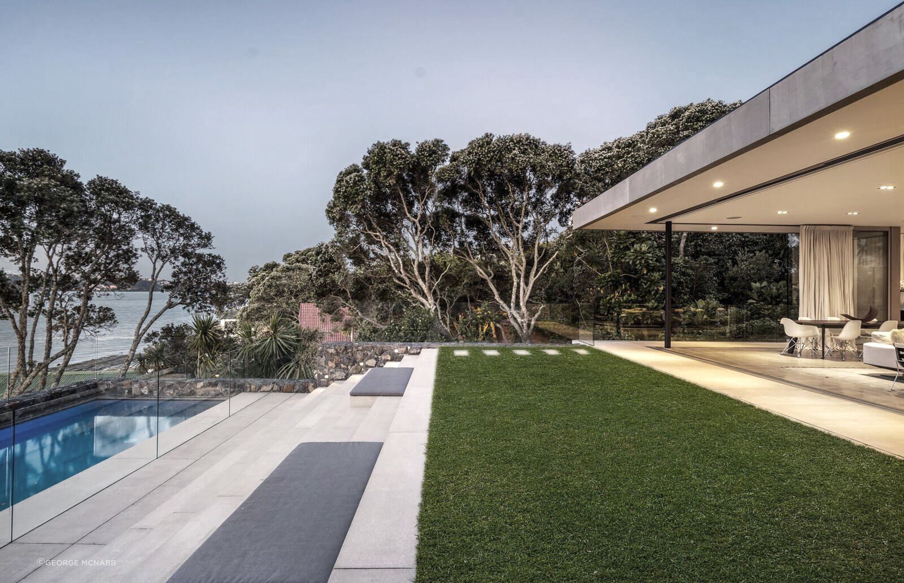 Beautifully landscaped terraces are an extension to the house, forming a lounge, a pool area and a dining space.