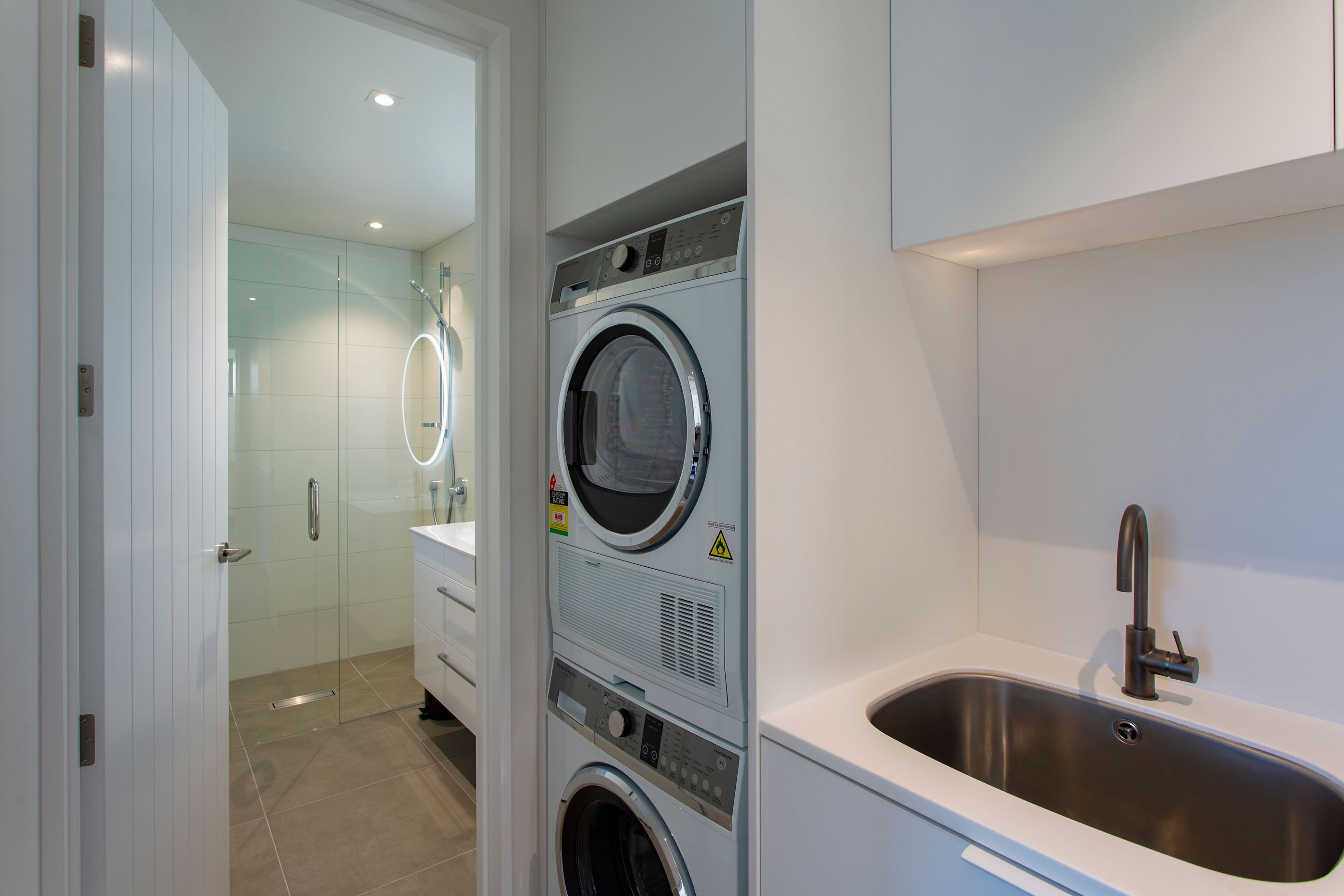 Compact laundry using F&amp;P stacker washer and dryer combo.