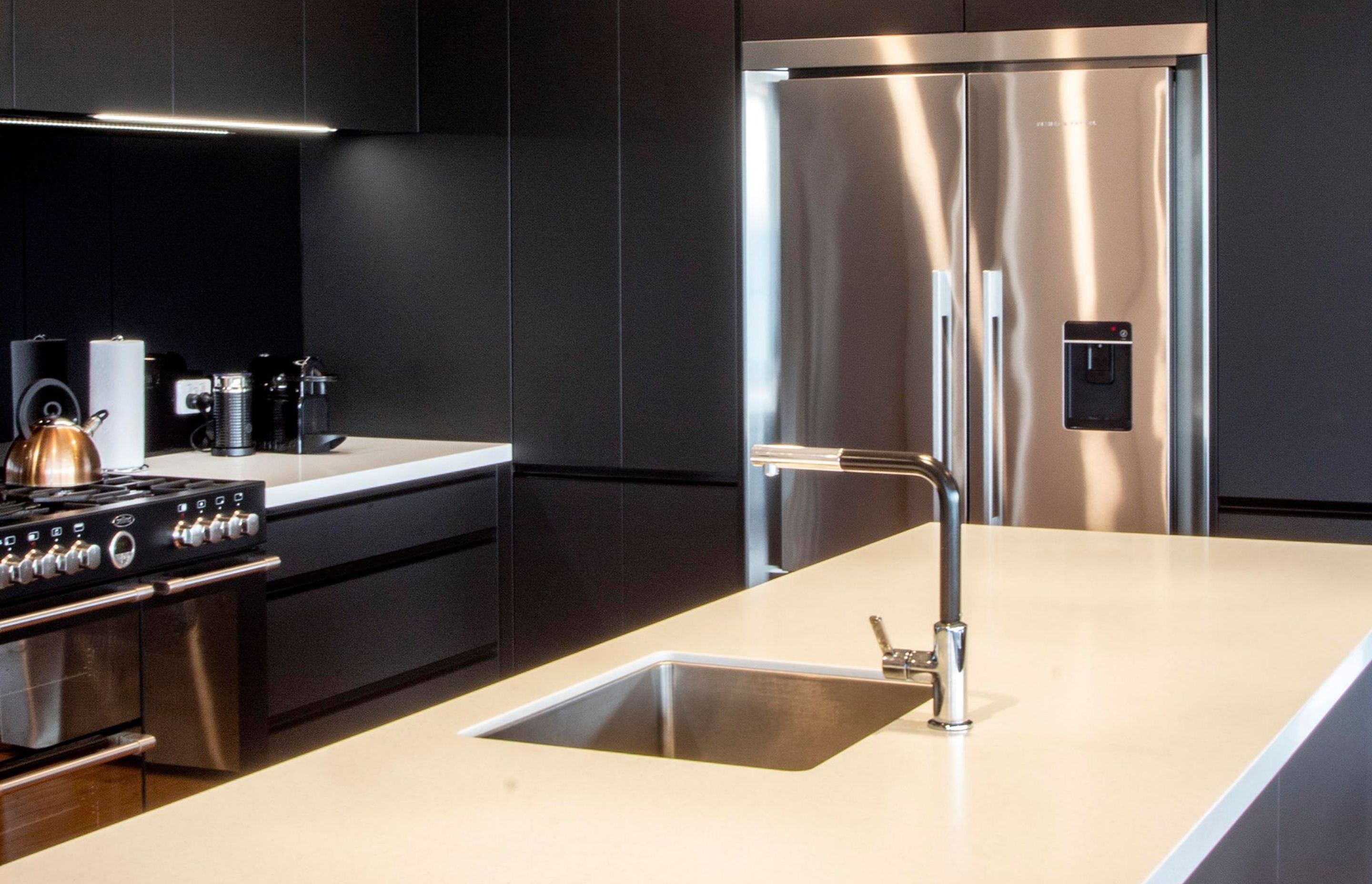 The elegant black, white and silver kitchen.