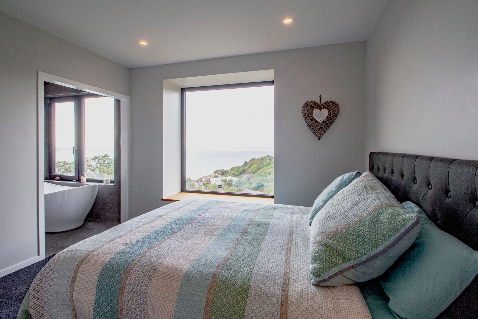 The master bedroom enjoys views over St Clair beach.