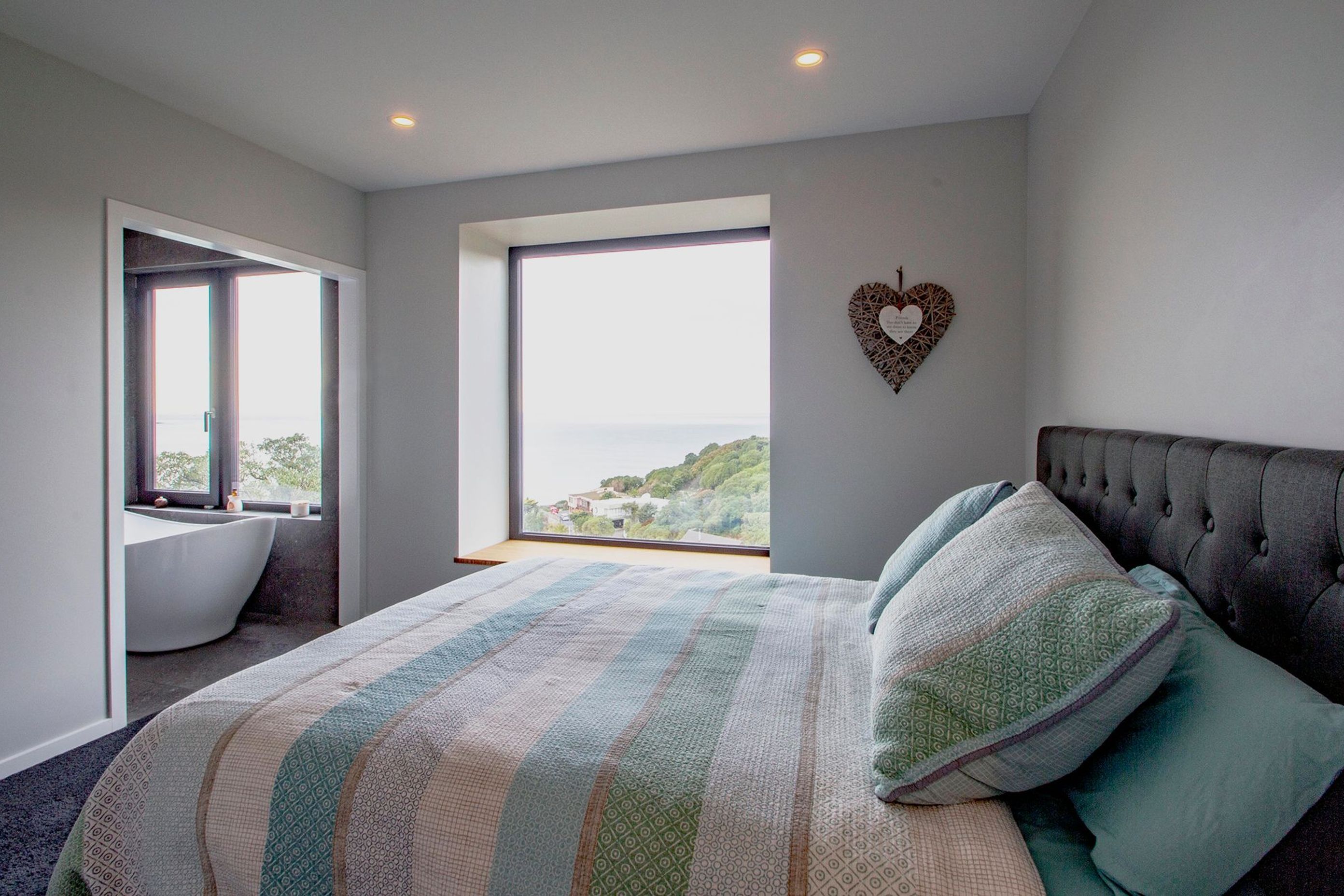 The master bedroom enjoys views over St Clair beach.