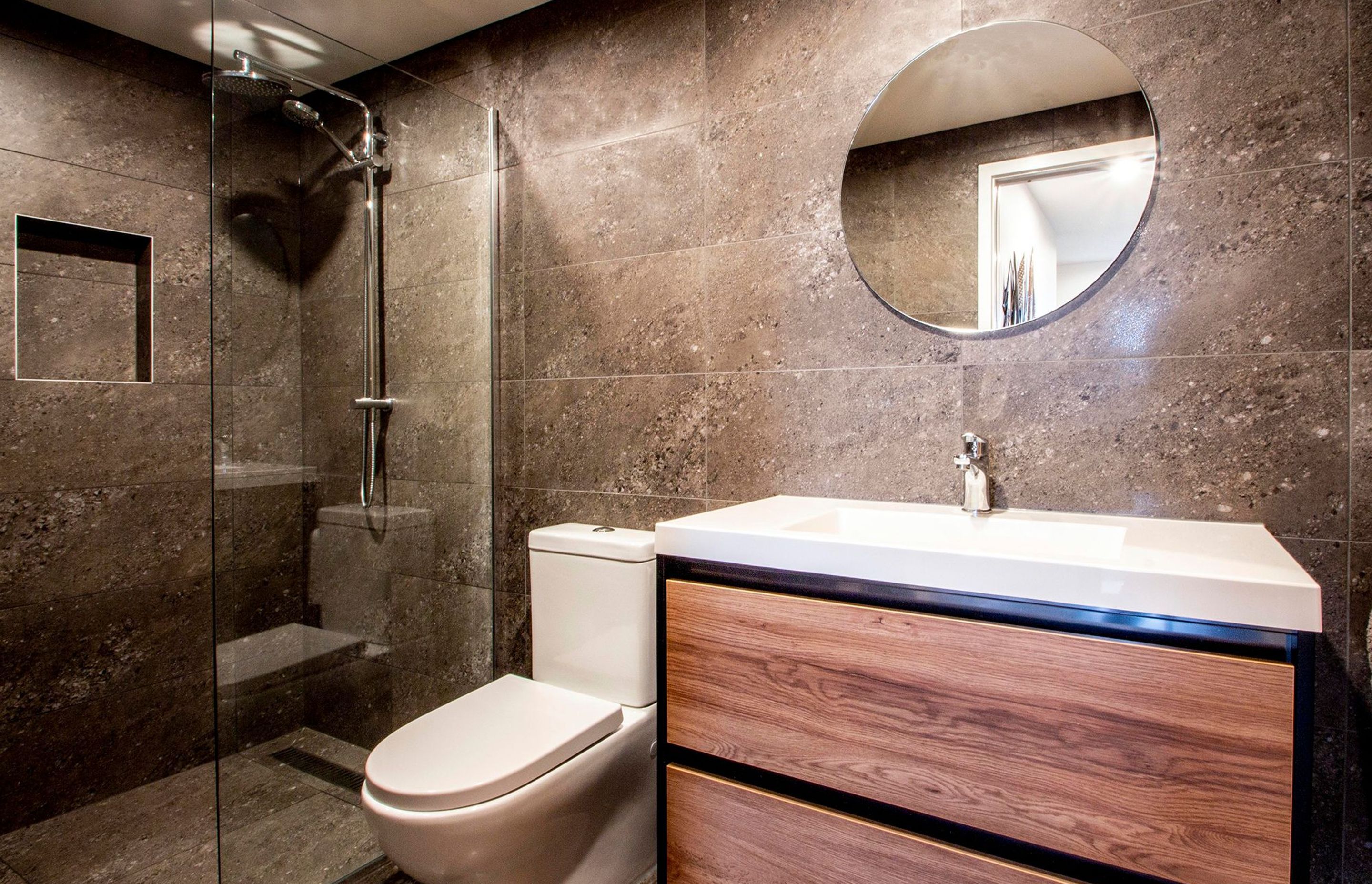 One of the bathrooms utilises natural materials.