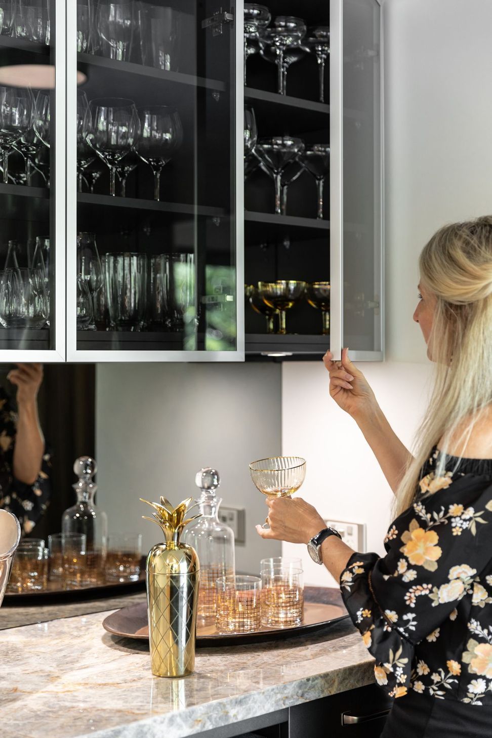 Reflections of the expansive verdent outlook are intentionally captured in the smoky mirror backings of the Wine Bar.