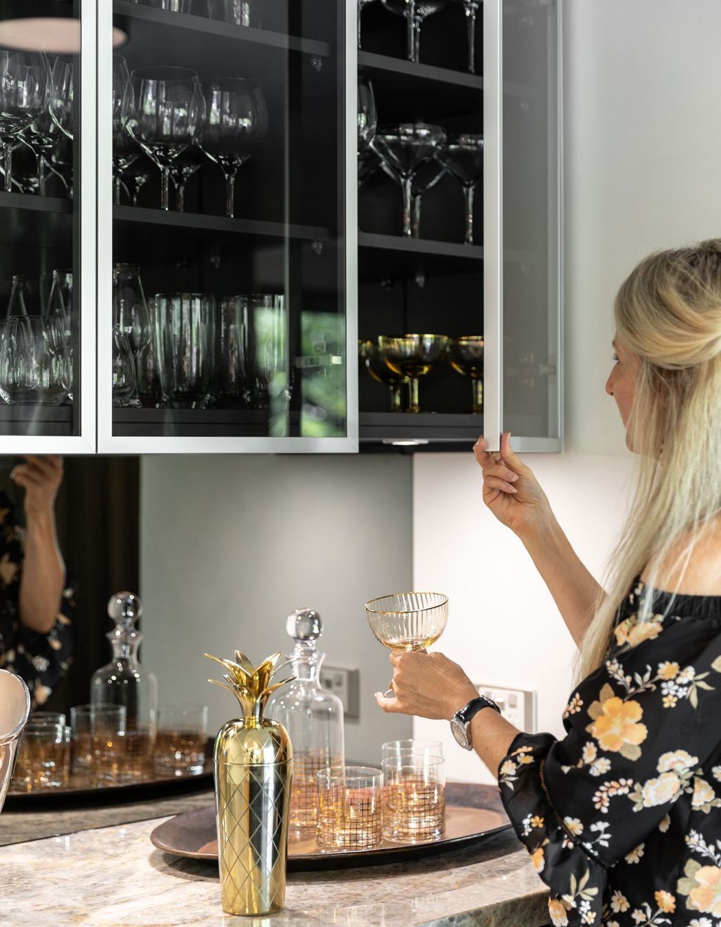 Reflections of the expansive verdent outlook are intentionally captured in the smoky mirror backings of the Wine Bar.