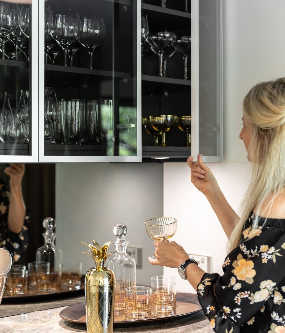 Reflections of the expansive verdent outlook are intentionally captured in the smoky mirror backings of the Wine Bar.
