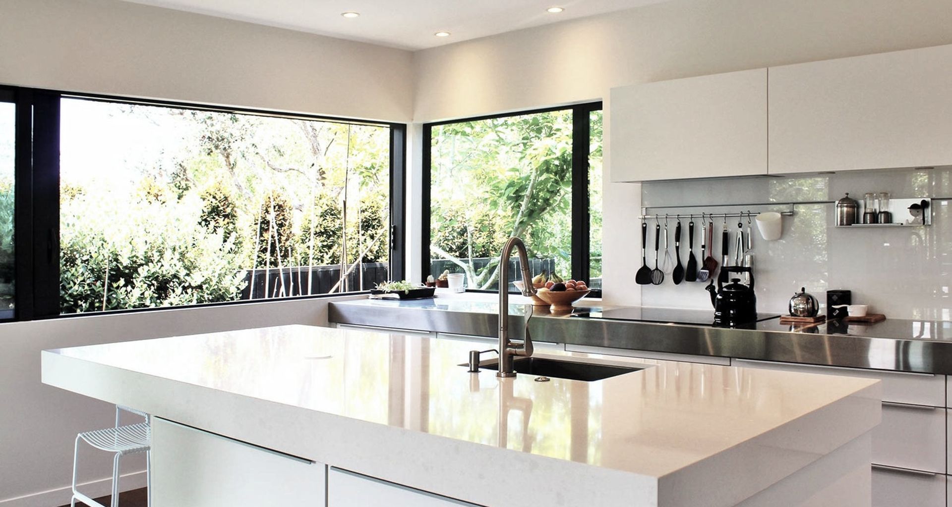 The kitchen is also bathed in light with large sliding windows opening the kitchen to the vege garden outside and drenching the island bench with sunlight.  