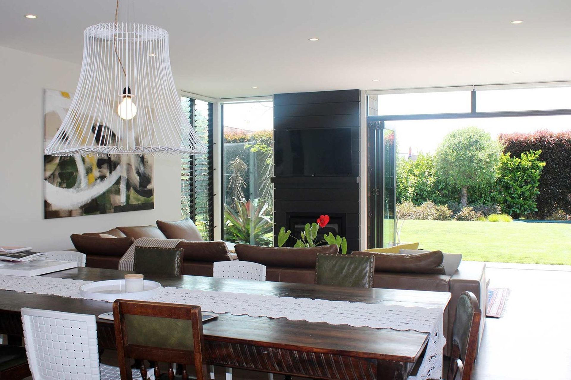 The dining and family room enjoy an abundance of light and connect directly to the north facing courtyard and western garden.