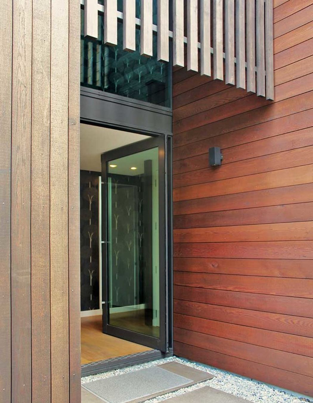 A double height glazed entry lets light penetrate the central hallway or circulation zone.