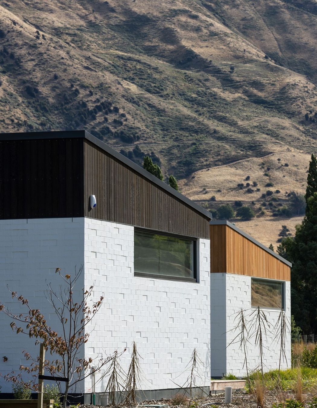 The homes are different shapes and sizes with varied materials to add variety.