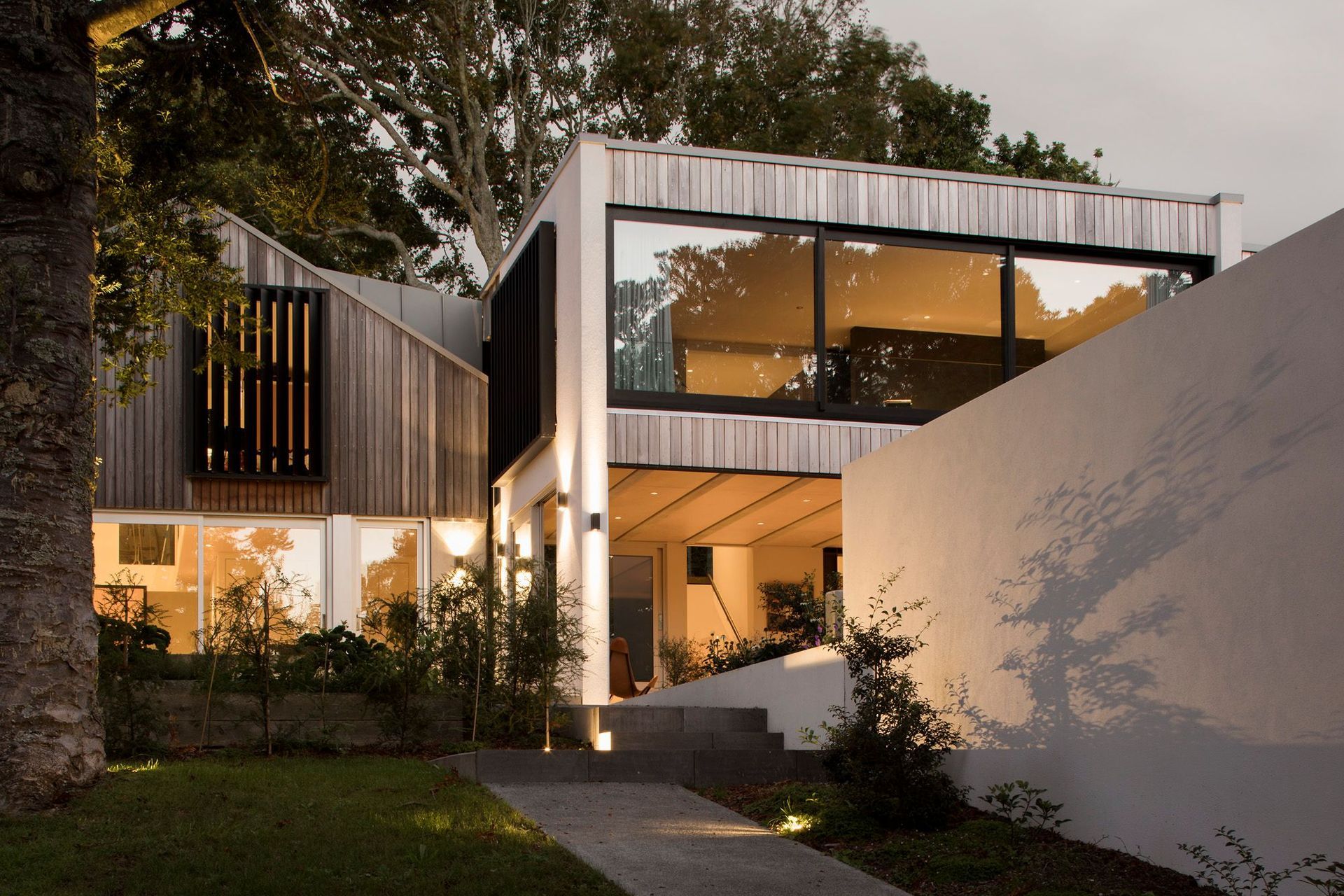 This 159 square metre, the two-level build was constructed with concrete formwork and flooring, with vertical cedar weatherboard detailing.