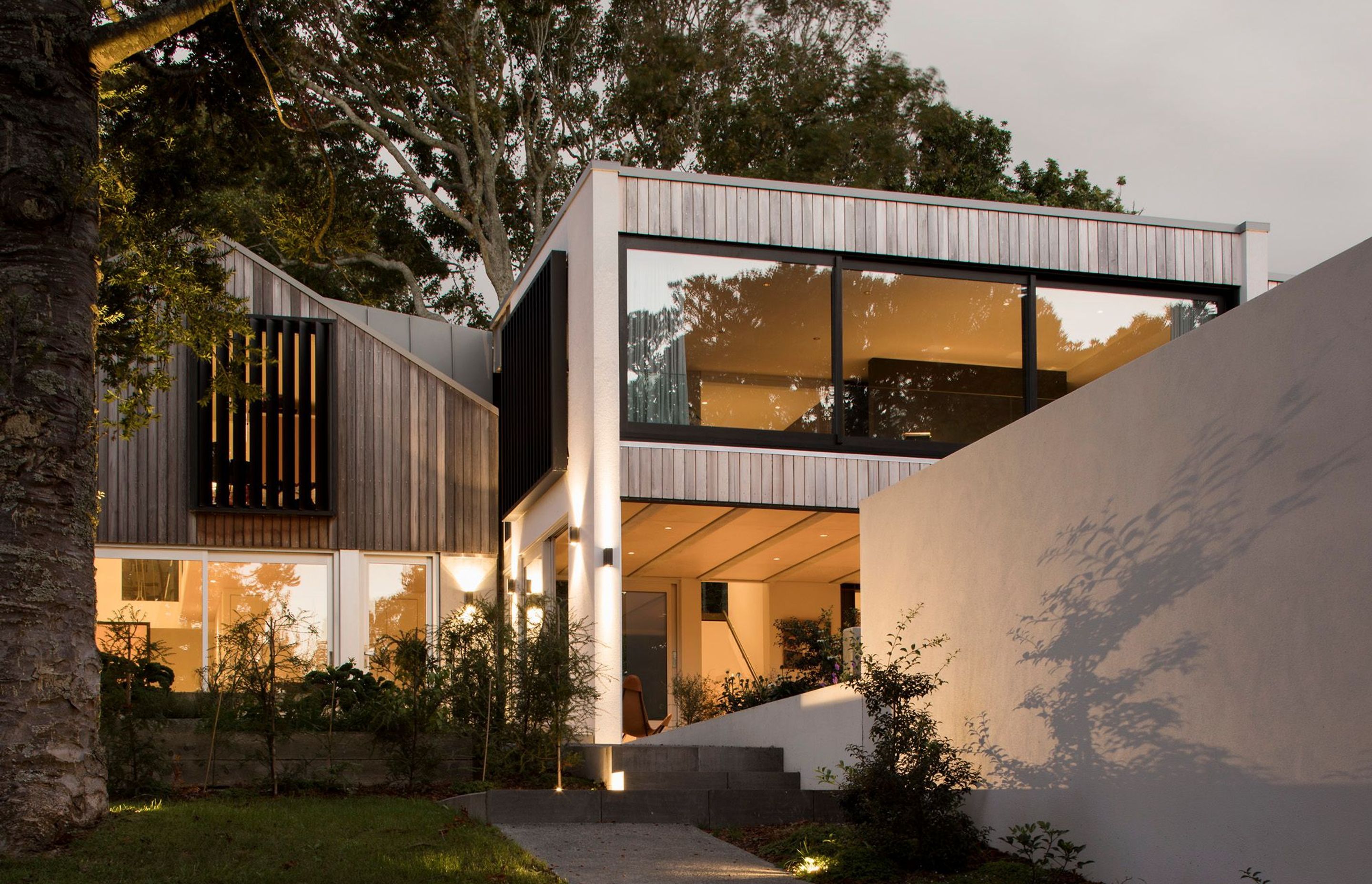 This 159 square metre, the two-level build was constructed with concrete formwork and flooring, with vertical cedar weatherboard detailing.