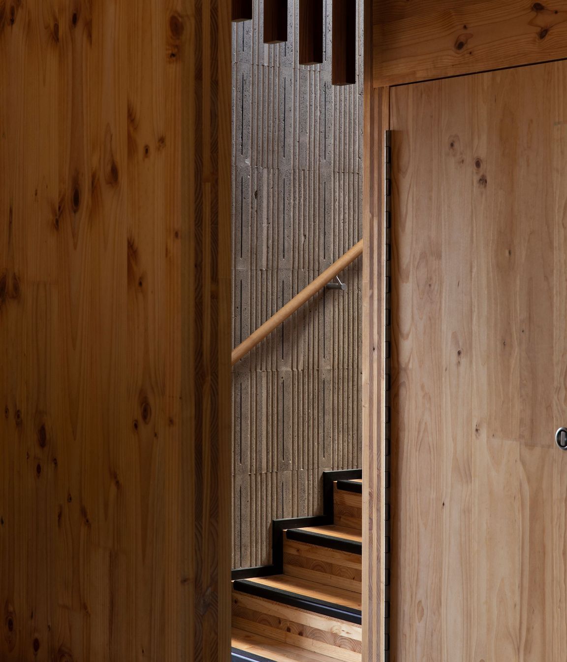 The stairwell to the upper level is constructed from insulated concrete form paneling.