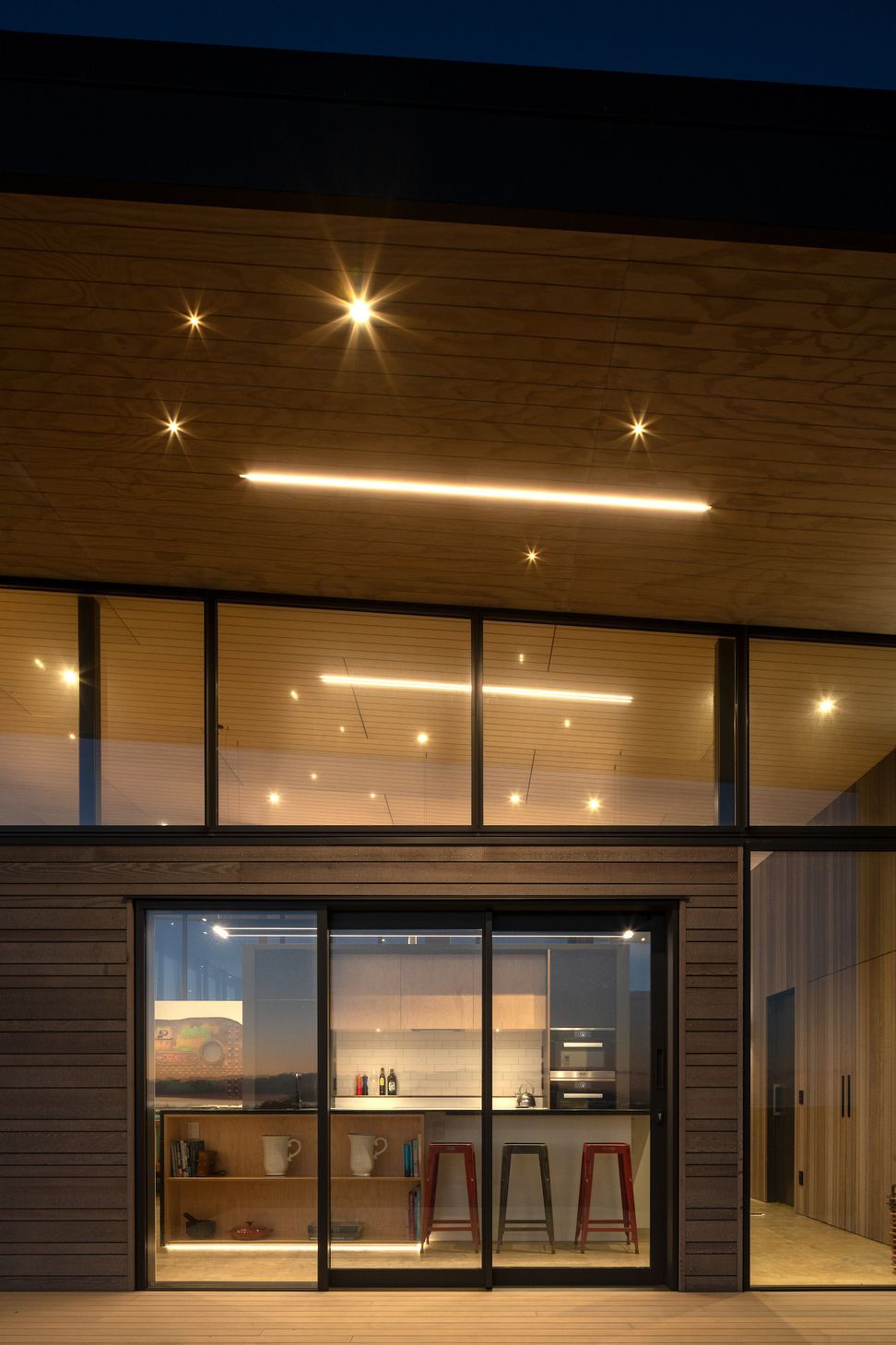 The cantilevered roof helps mitigate solar gain on the west-facing side of the house, which also happens to be where the view is.