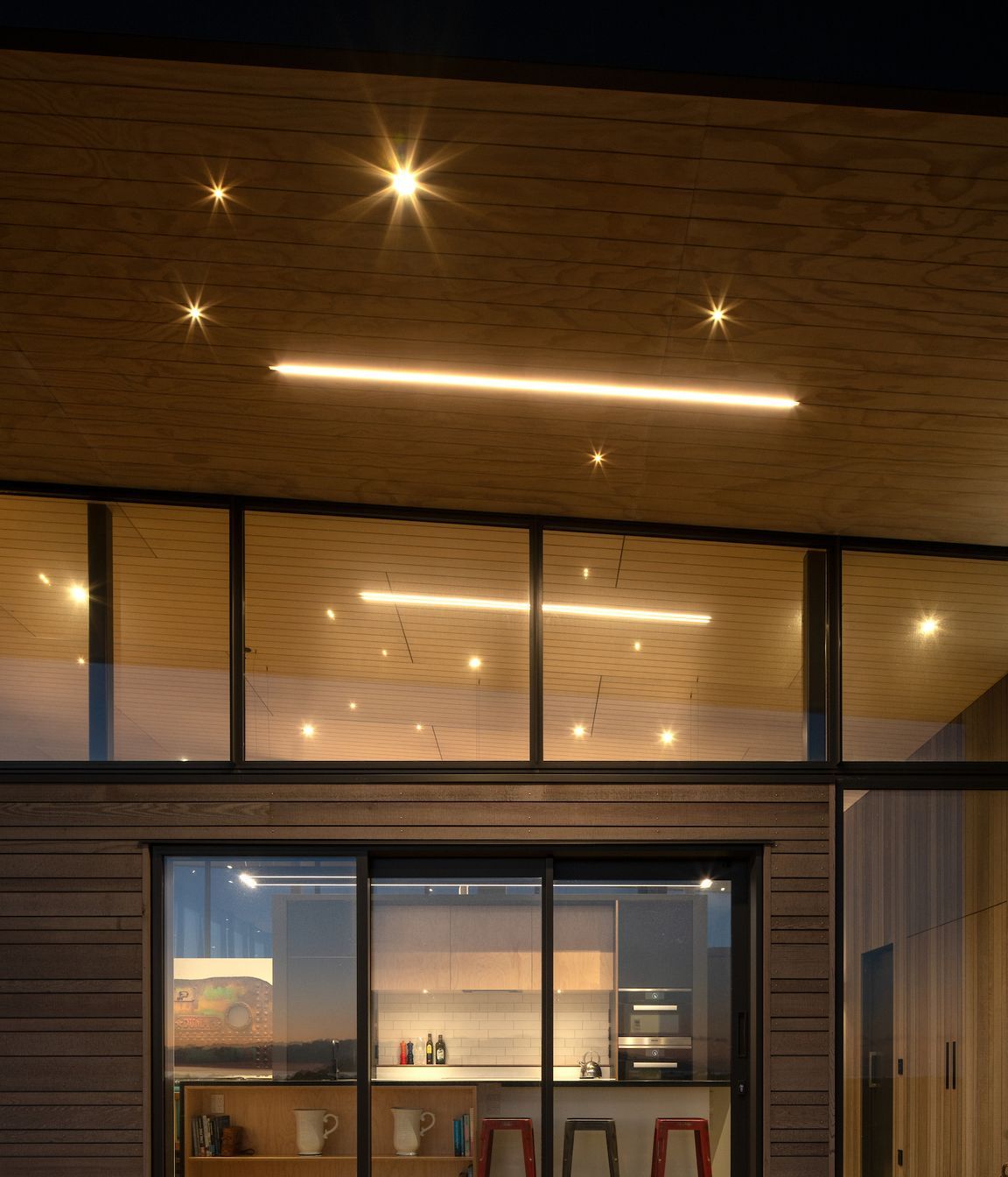 The cantilevered roof helps mitigate solar gain on the west-facing side of the house, which also happens to be where the view is.