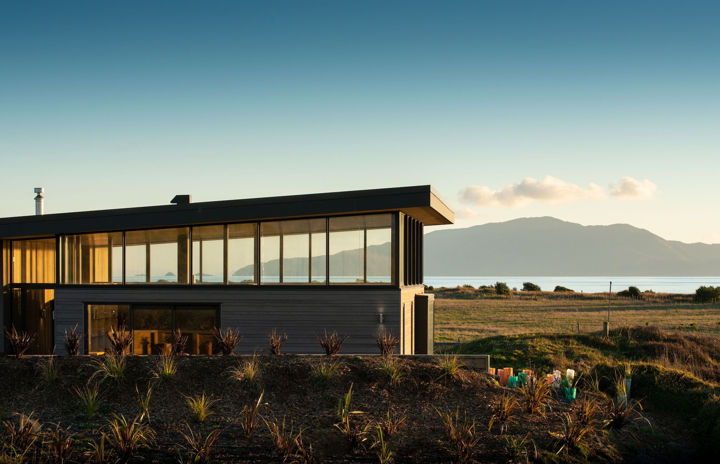 To preserve the feeling of being remote, the house was designed to be long, low and hunkered into the topography.