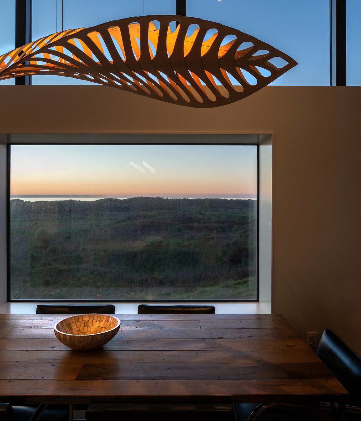 Vignettes of the landscape provide an ever-changing vista, while light and shadow from the feature pendant plays across the interior surface.