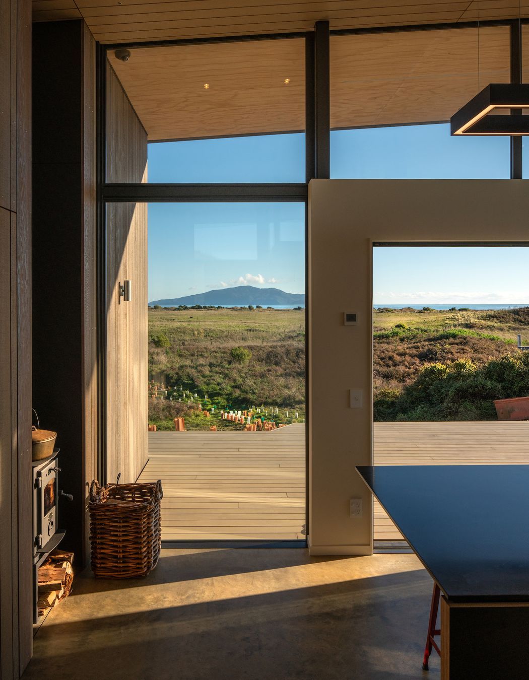 The west-facing deck enjoys plenty of sun while the concrete floor provides thermal mass ensuring the warmth gained during the day is slowly released at night.