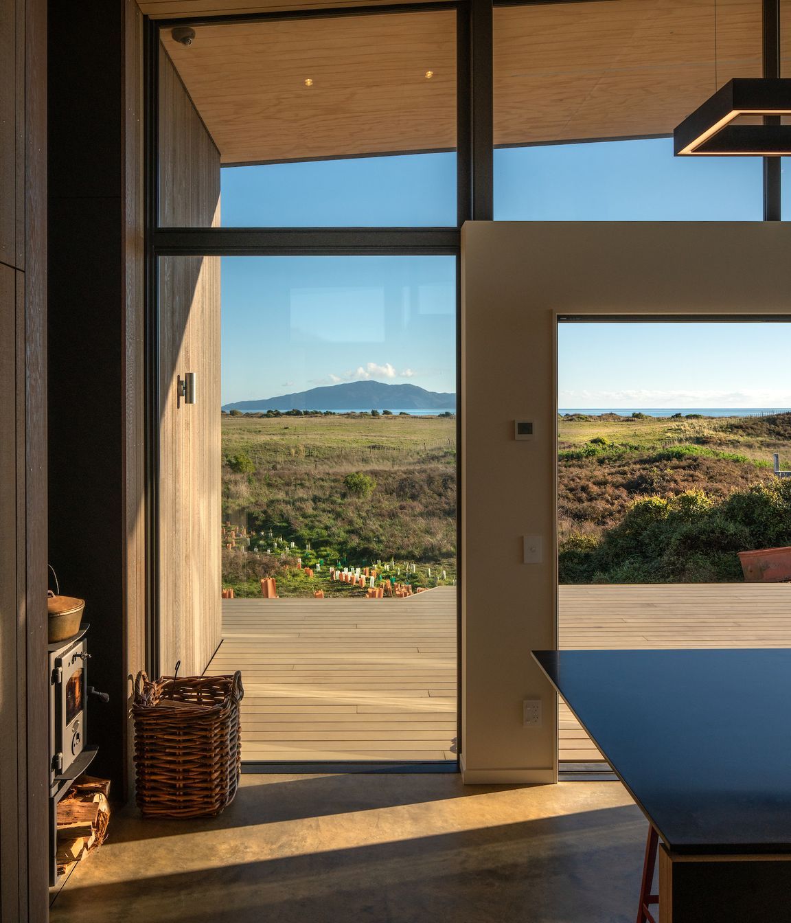 The west-facing deck enjoys plenty of sun while the concrete floor provides thermal mass ensuring the warmth gained during the day is slowly released at night.
