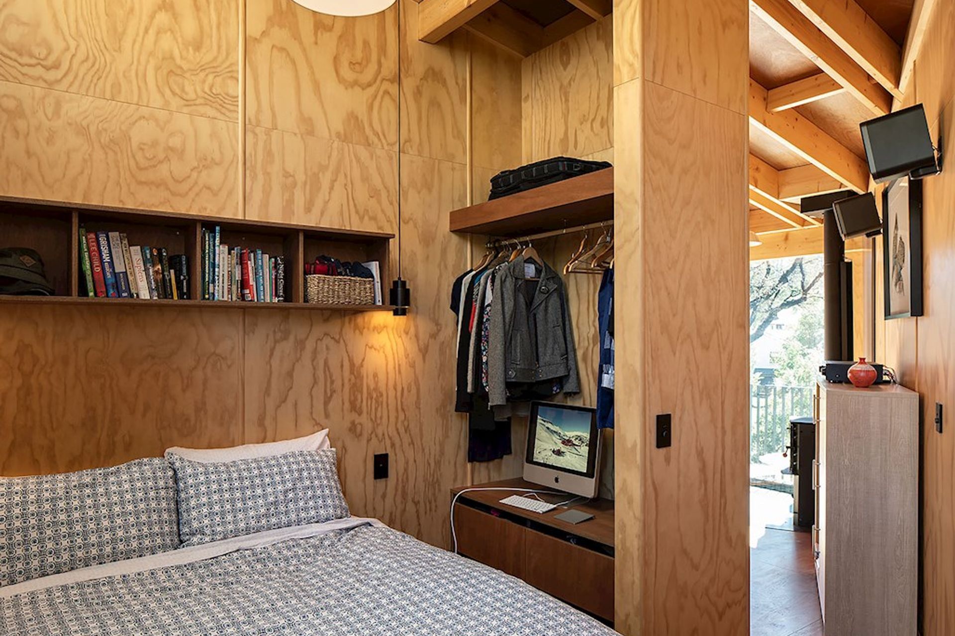 The master bedroom has no door, just a turning in the entry to provide privacy.