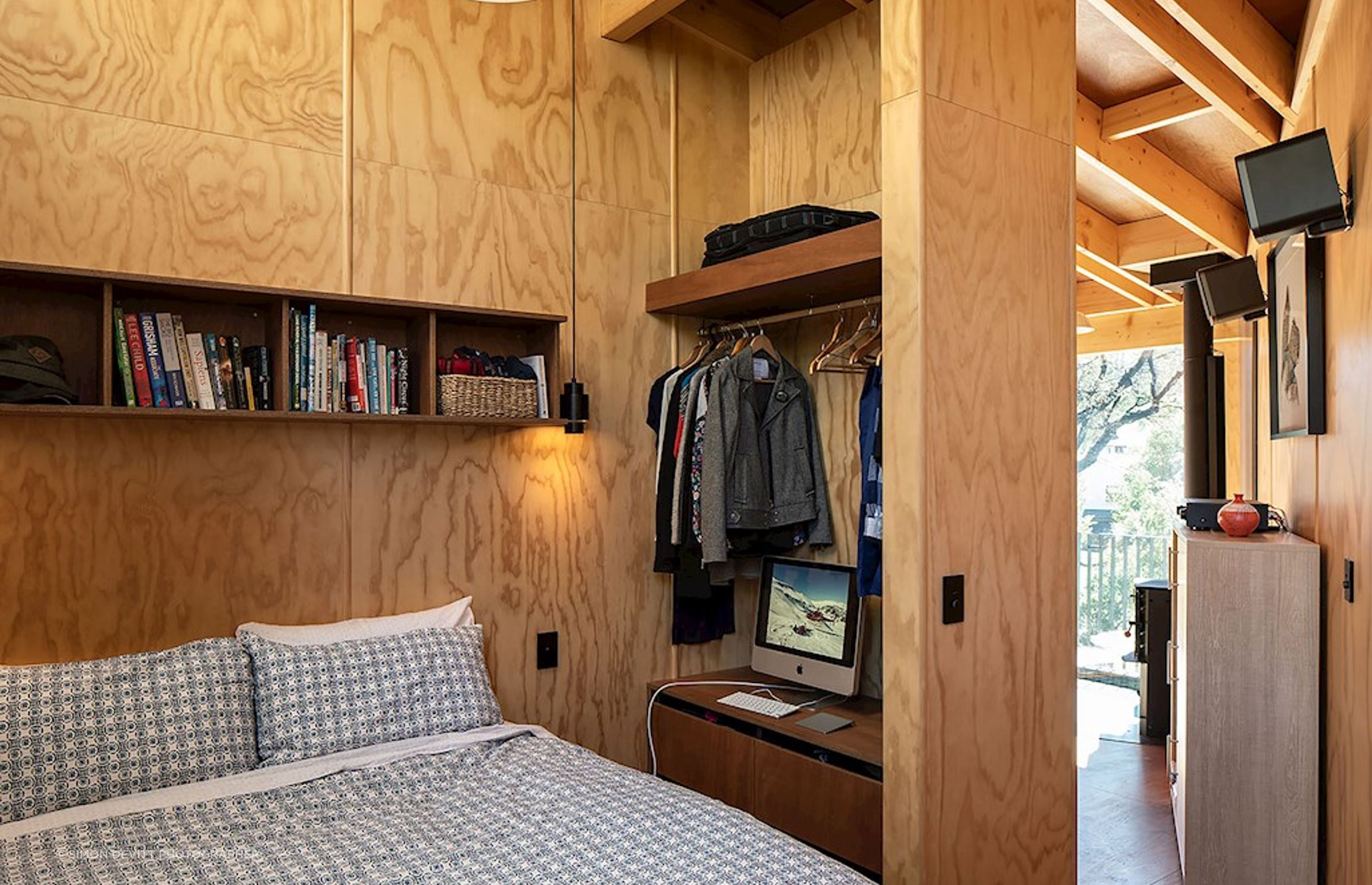 The master bedroom has no door, just a turning in the entry to provide privacy.