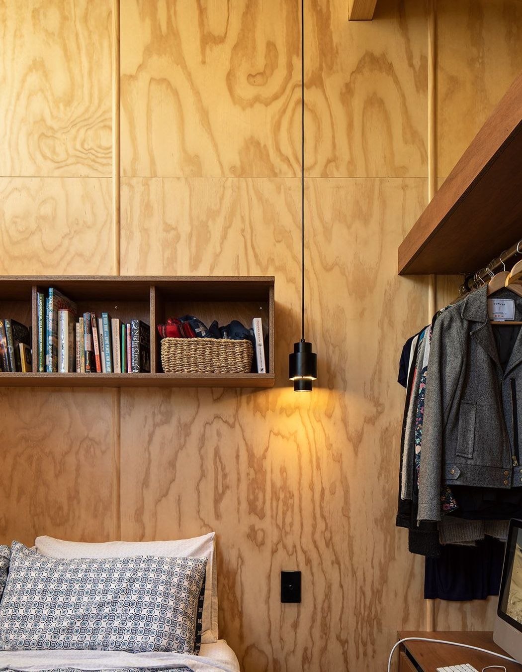 Open shelves in the master bedroom continues the 'humble hut' aesthetic.