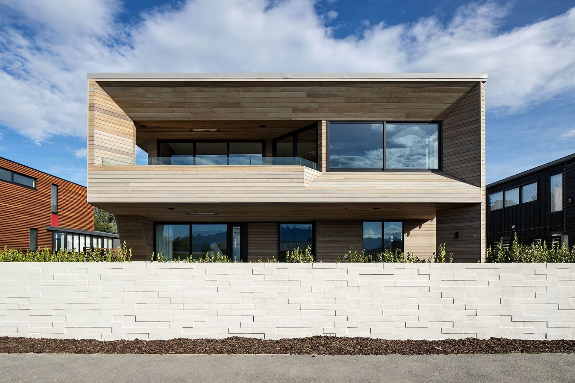 Te Whare Rakau's site offers stunning lake views from the first floor, so the main living spaces and balcony have been placed on the upper level to take advantage of the outlook. 