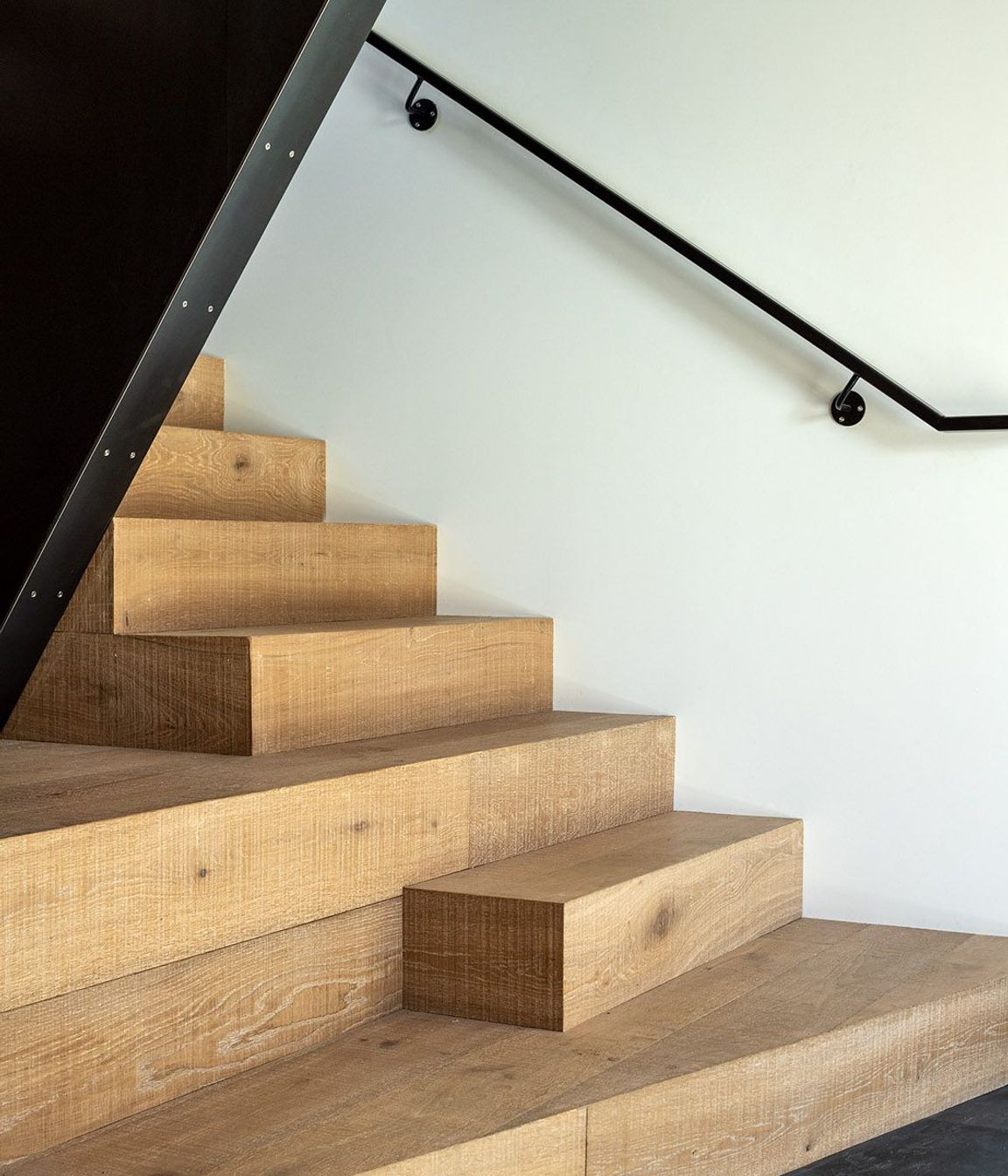 The bottom of the staircase on the ground floor.