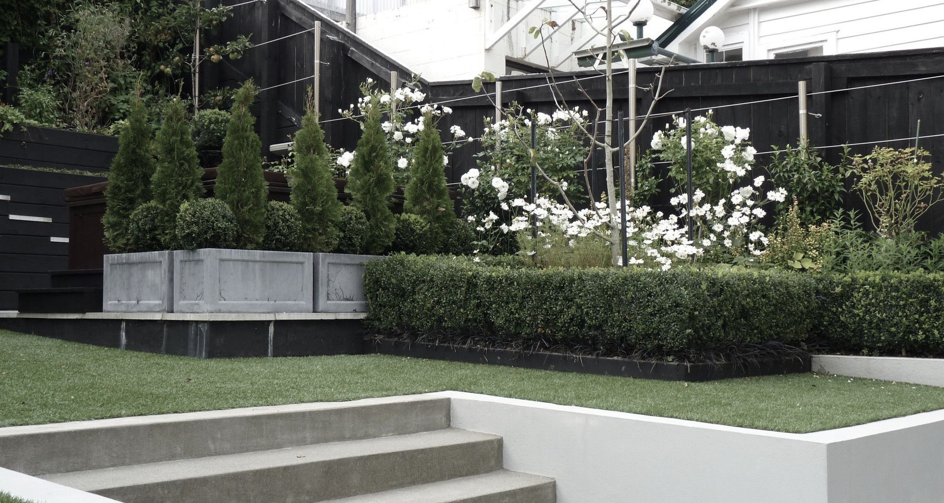 The Glen: stylish family garden with all the toys banner