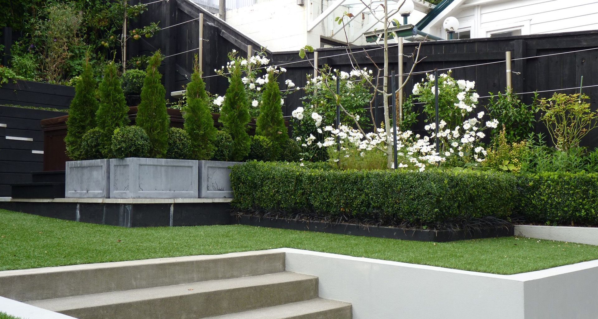 The Glen: stylish family garden with all the toys banner