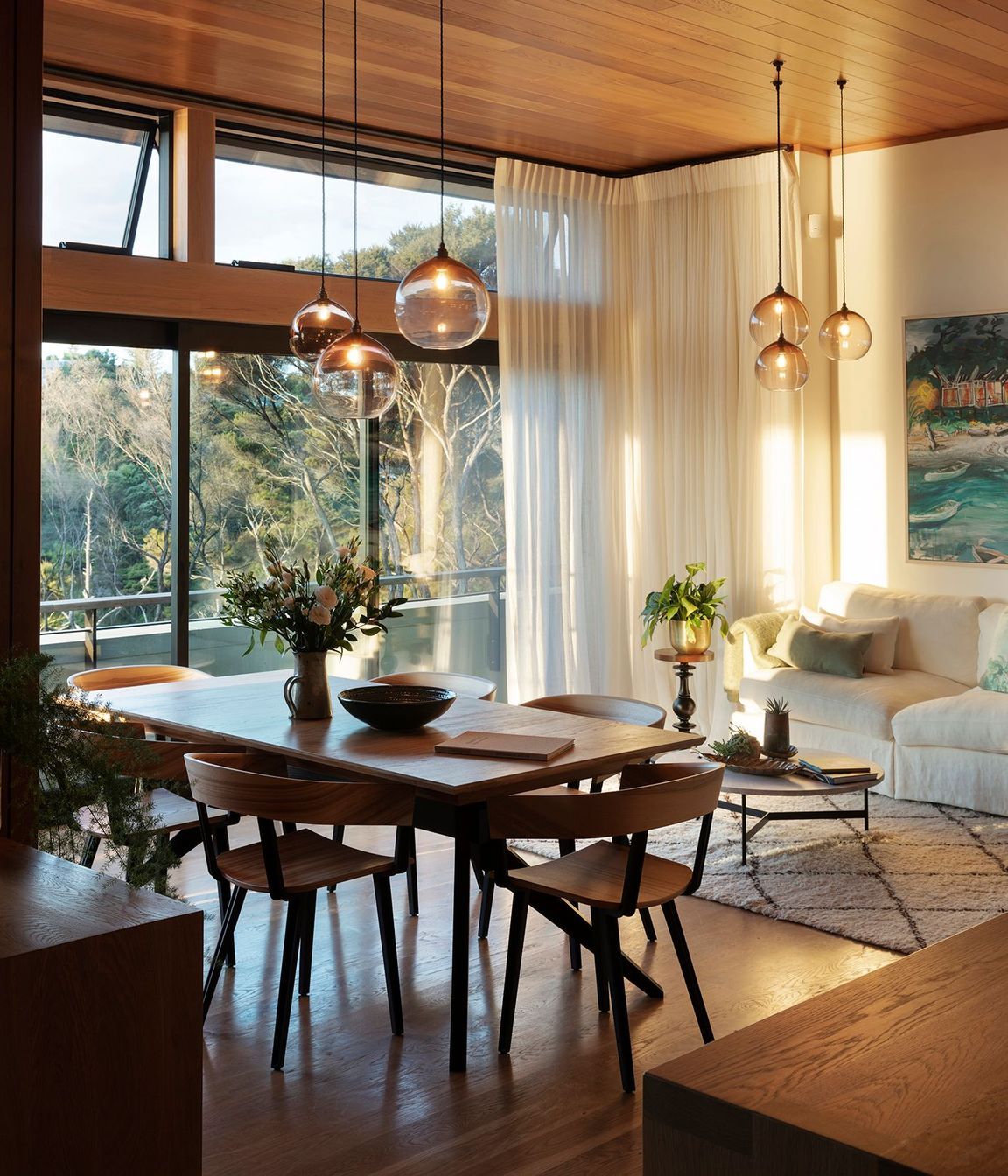 High-level windows draw light into the liviing/dining space during the winter months.