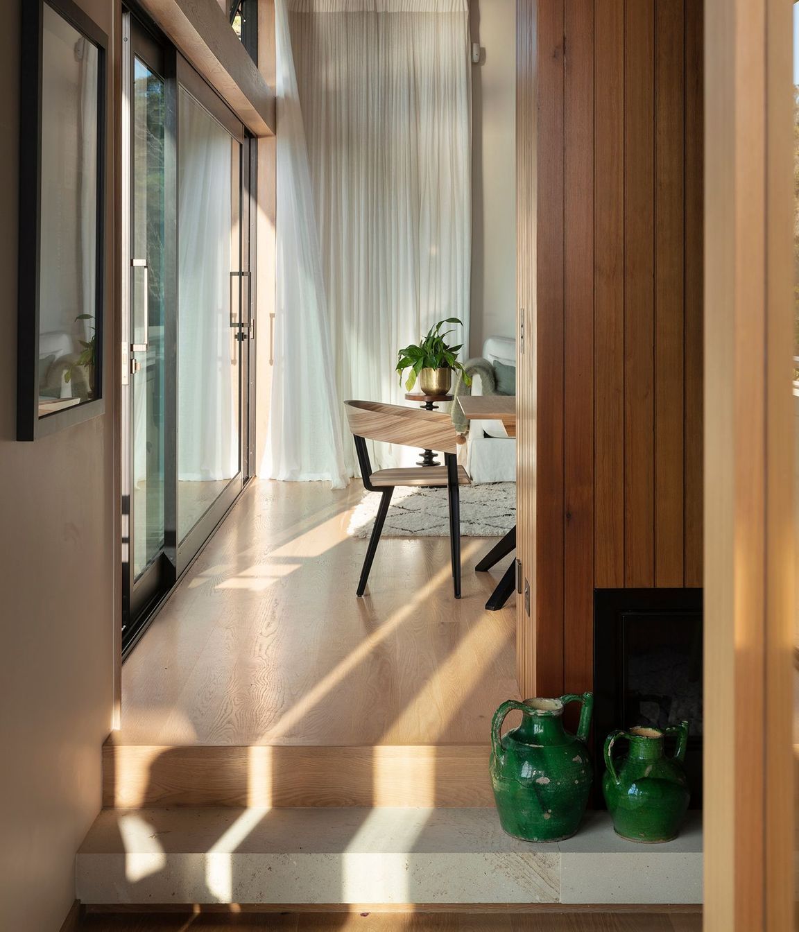 Step changes in the floor help to define spaces and create journeys around the home.