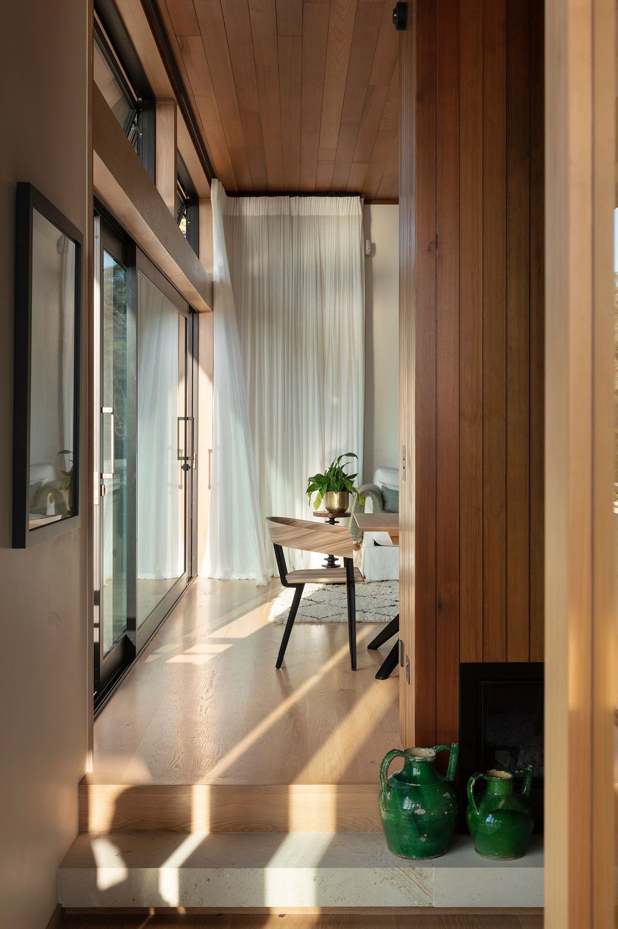 Step changes in the floor help to define spaces and create journeys around the home.