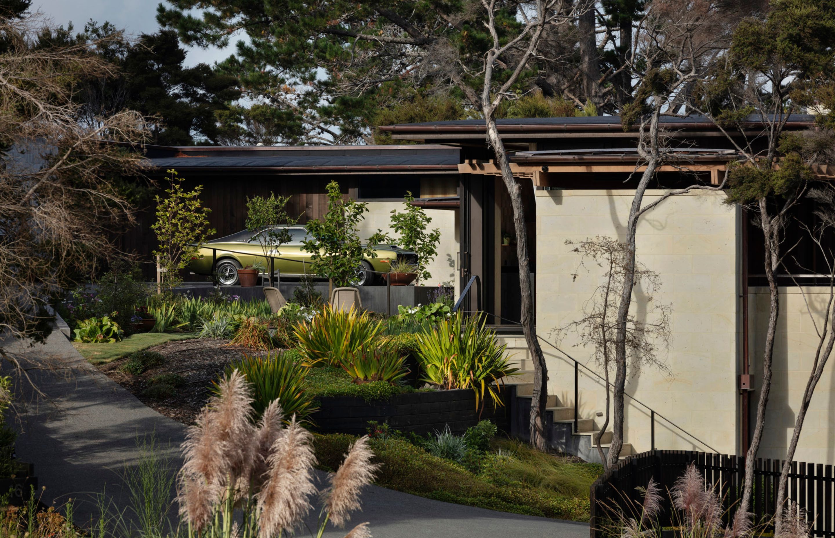 Set within regenerating bush, The Knoll is a stunning example of Kiwi modernism – inspired by Frank Lloyd Wright's Usonian houses with a rational plan and a richly crafted interior.