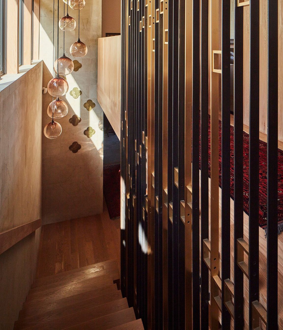 Looking down the feature staircase from the upper to lower levels.
