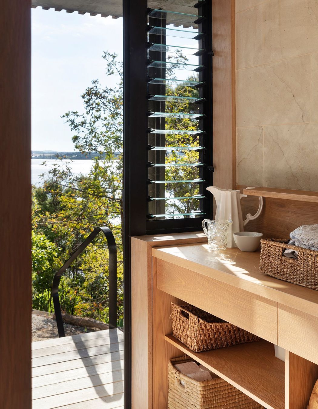 The timber-rich laundry has louvred windows for extra ventilation.