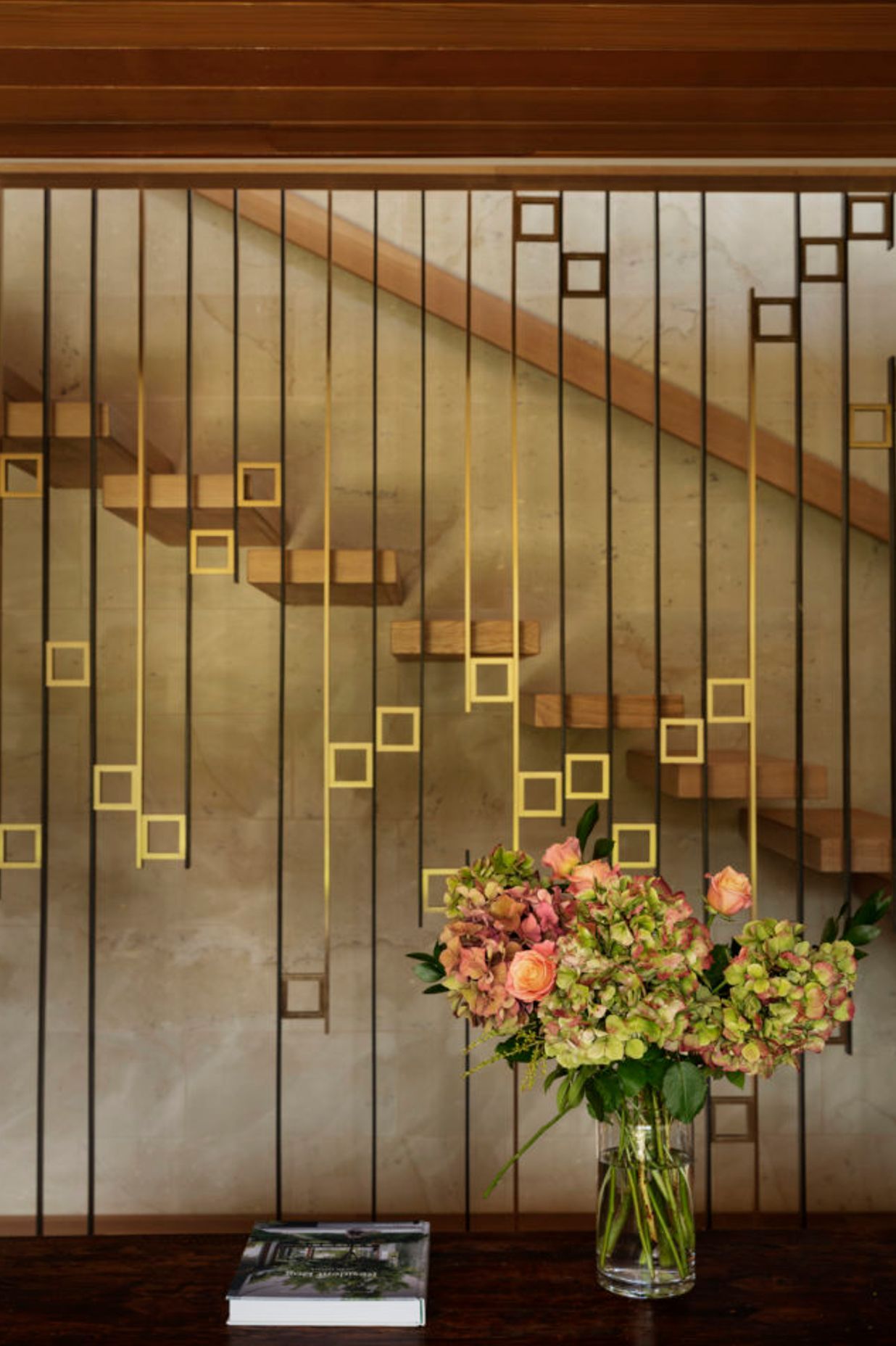 The beautiful staircase screen was designed by Edwards and crafted by Powersurge.