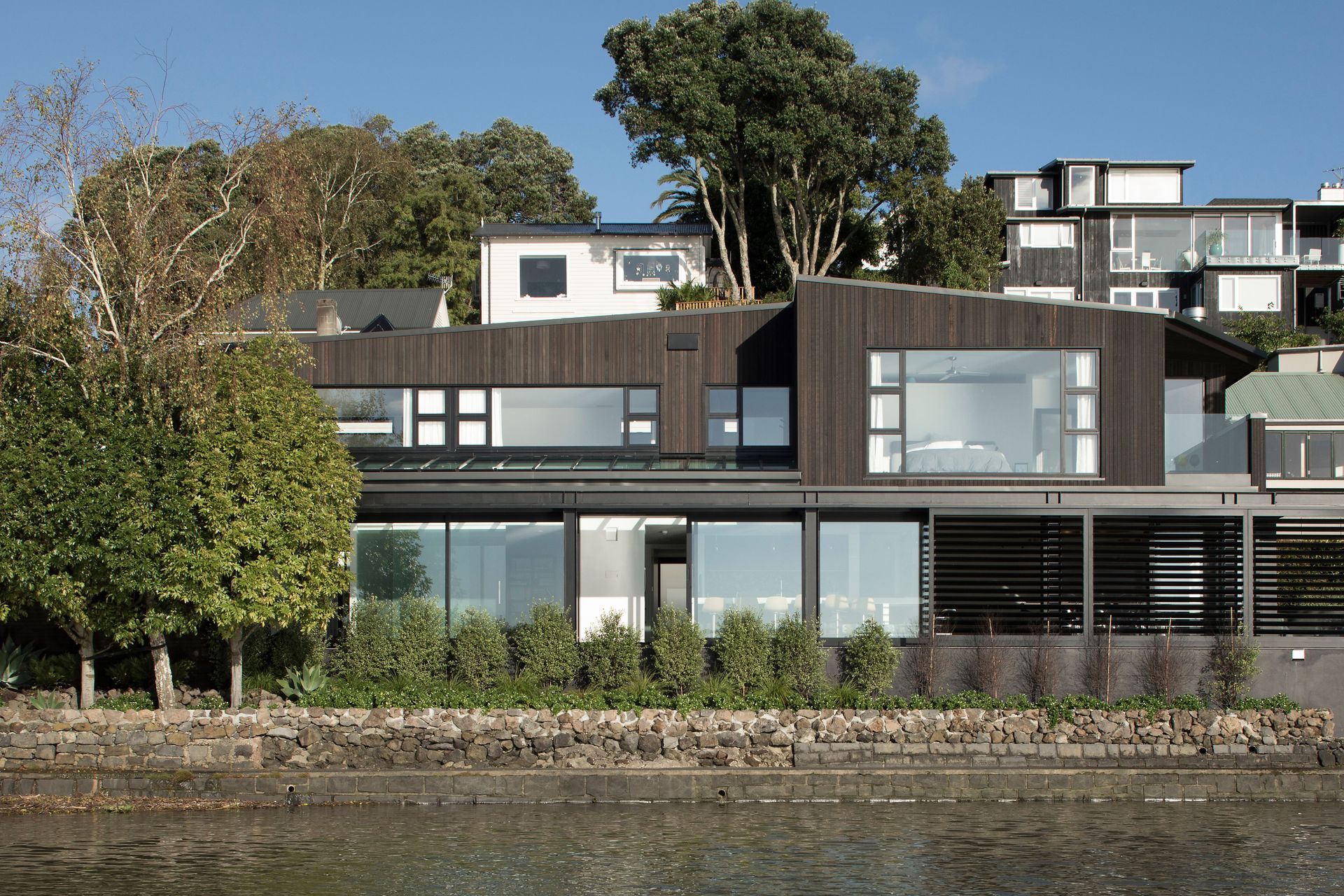 A view of The Tailored Home from the waters of Hobson Bay in Parnell.