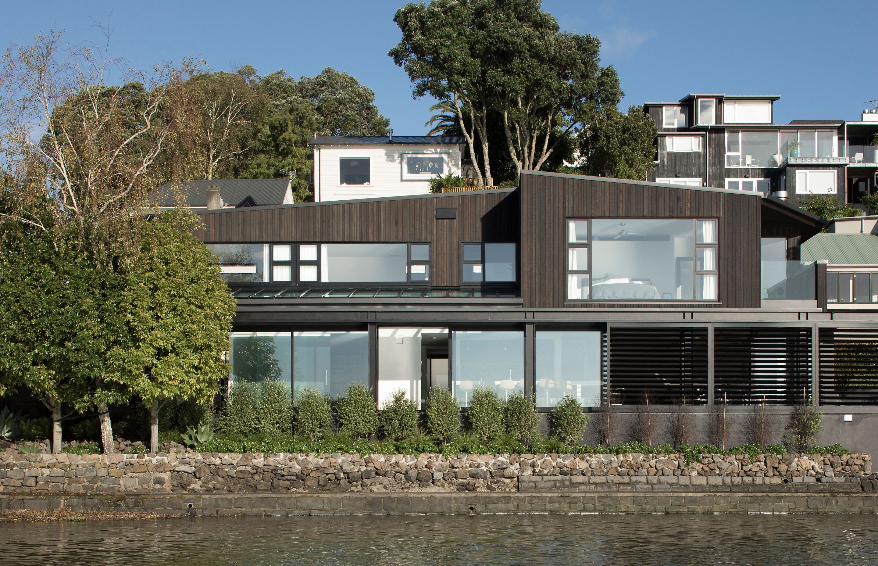 A view of The Tailored Home from the waters of Hobson Bay in Parnell.