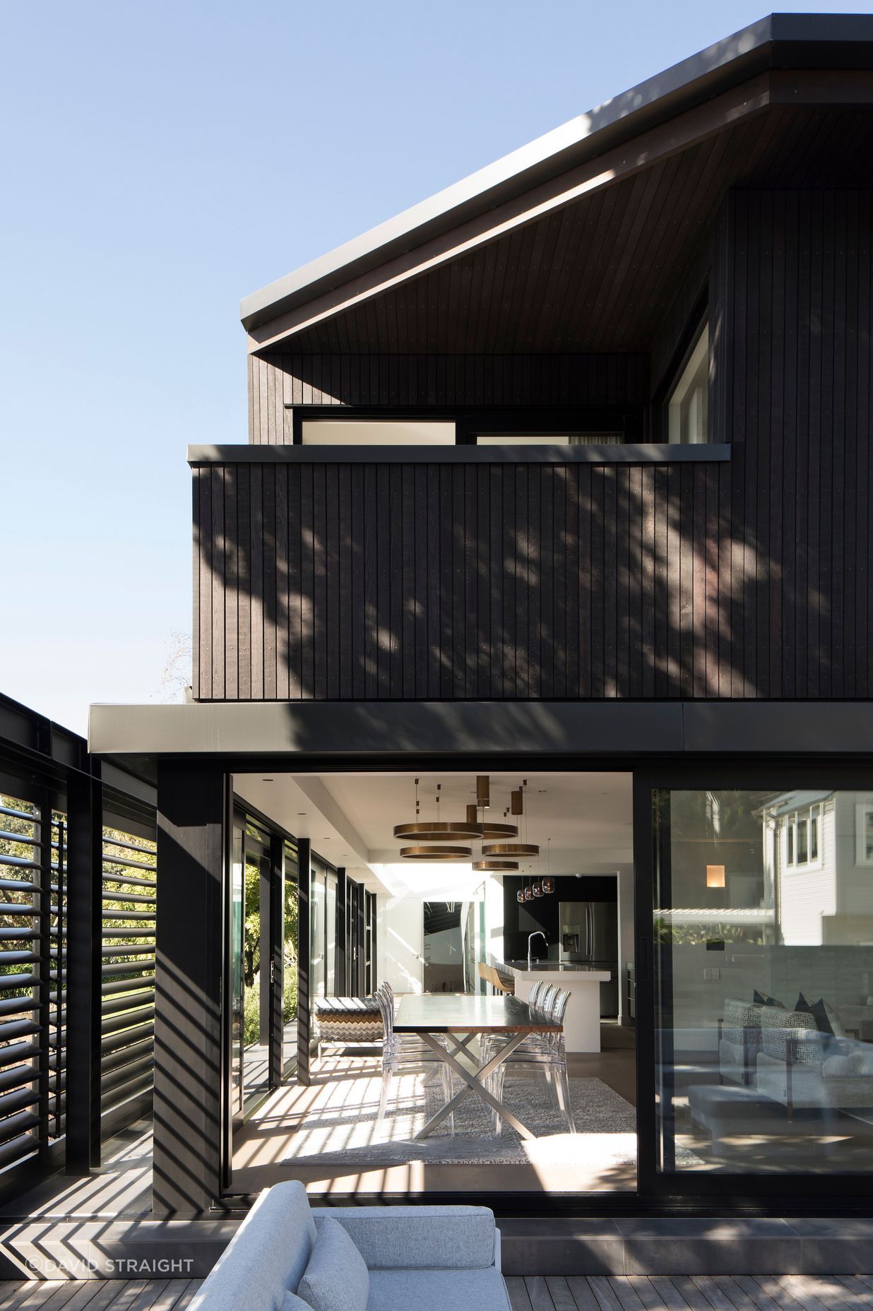 View of the main living area and, above, the master bedroom with its sheltered balcony.