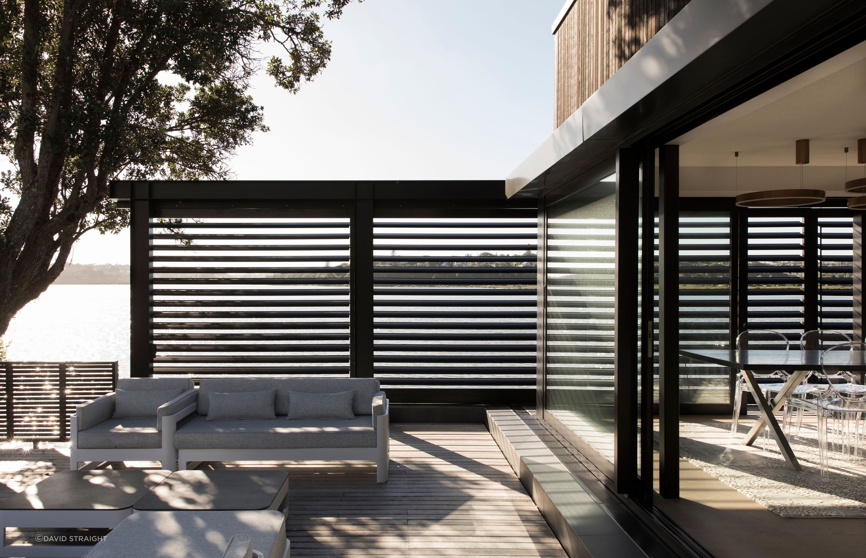 An outdoor room is the perfect waterside place to lounge during the warmer months.