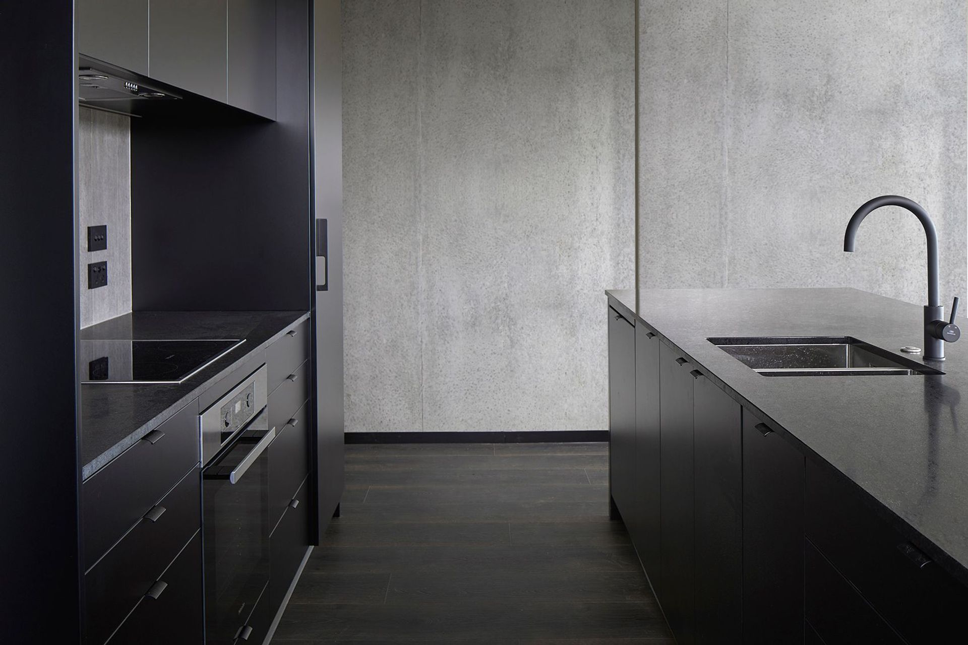 A moody colour palette and raw materials are a feature of some of the apartments, helping to create an aspirational aesthetic.