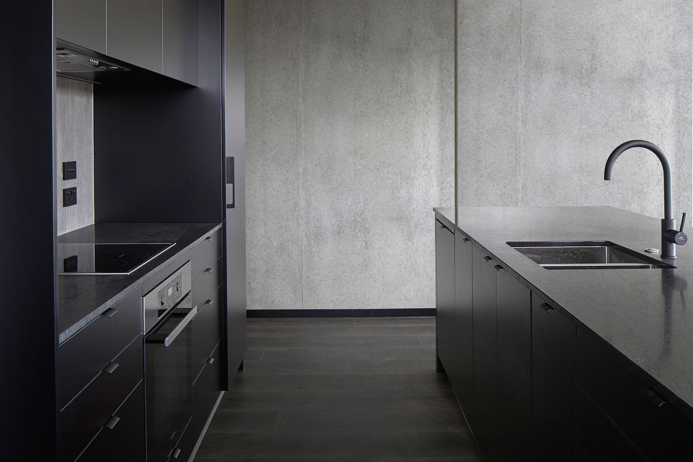 A moody colour palette and raw materials are a feature of some of the apartments, helping to create an aspirational aesthetic.