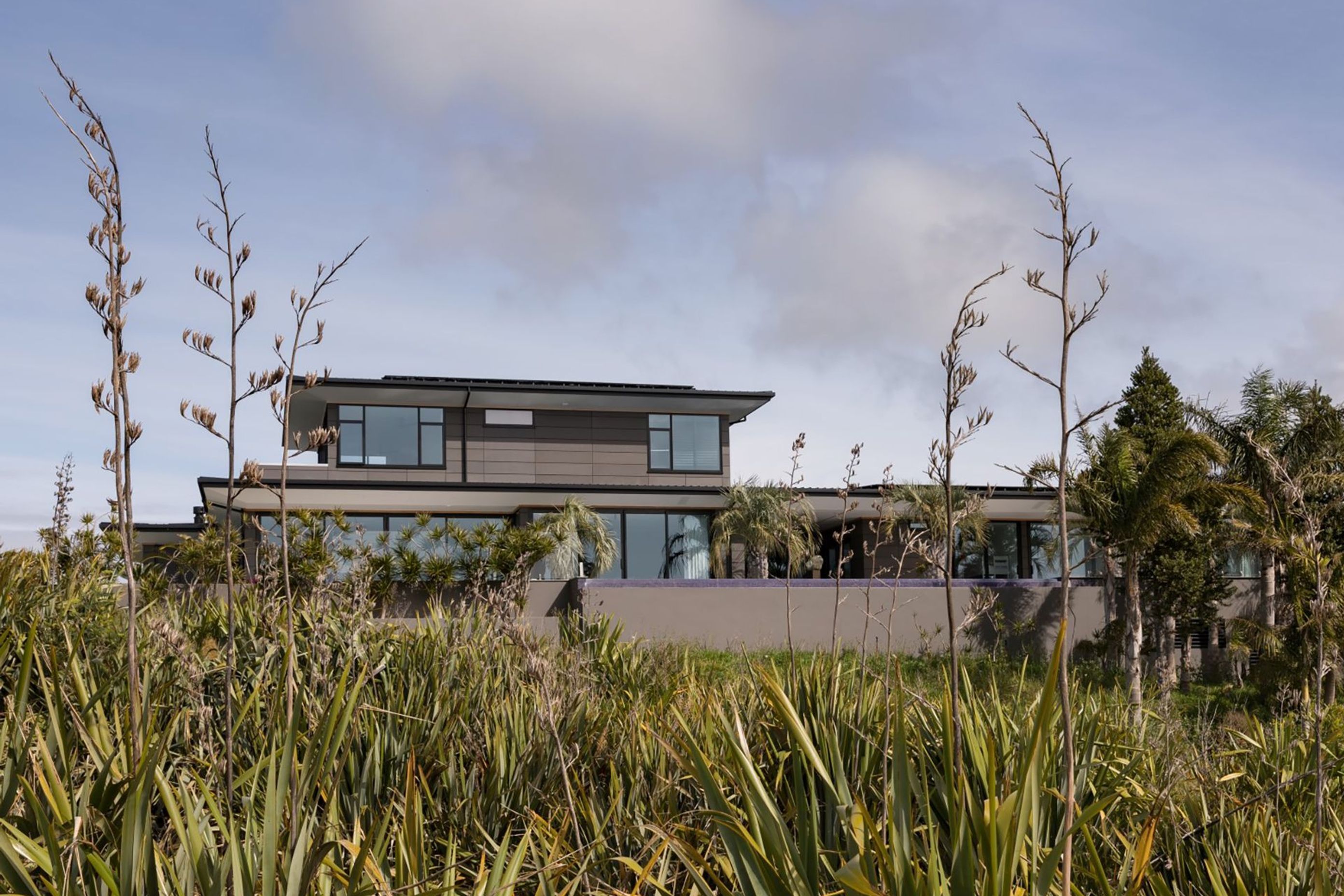 The house is designed to sit sympathetically within the coastal landscape.