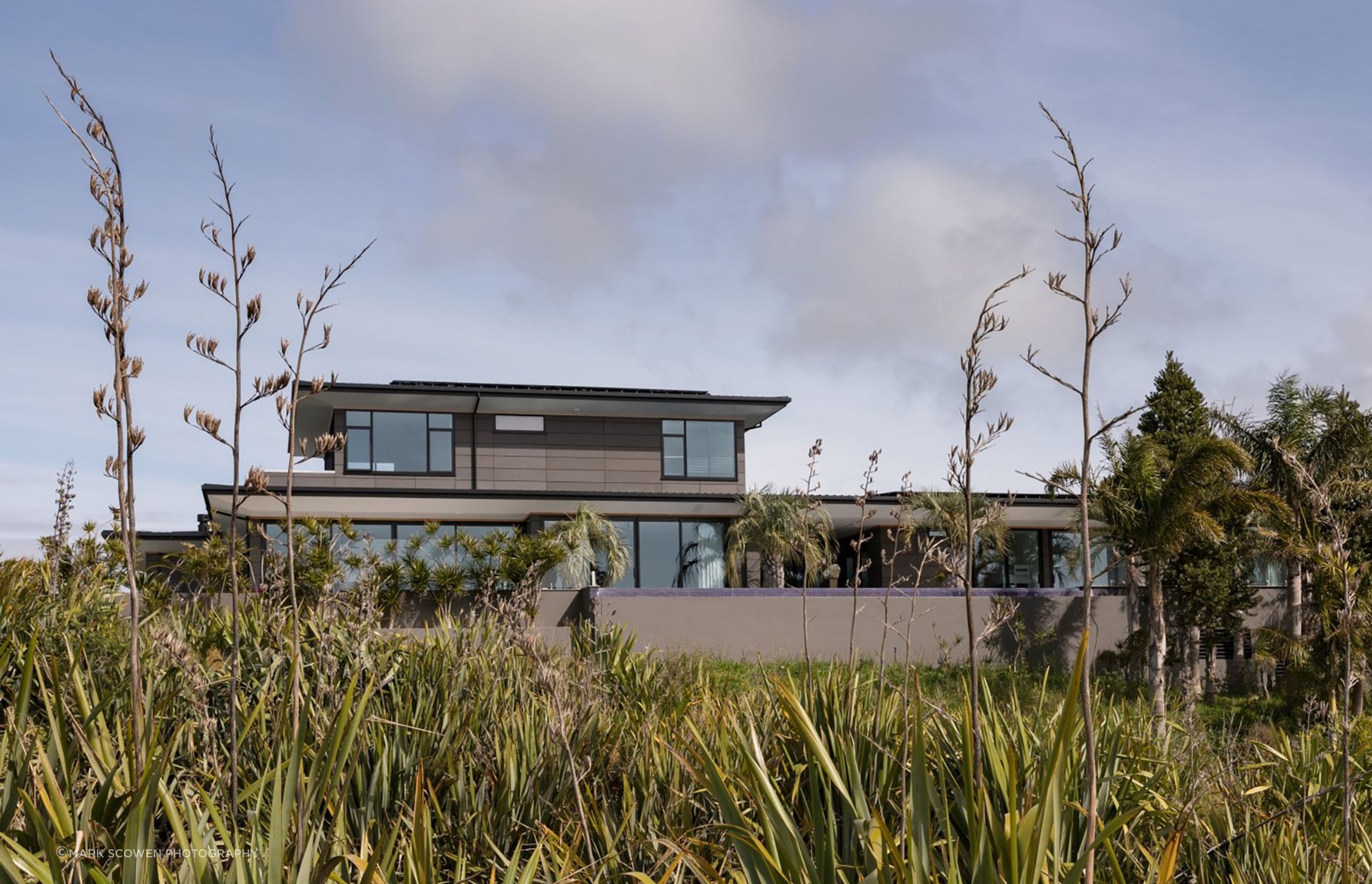 The house is designed to sit sympathetically within the coastal landscape.