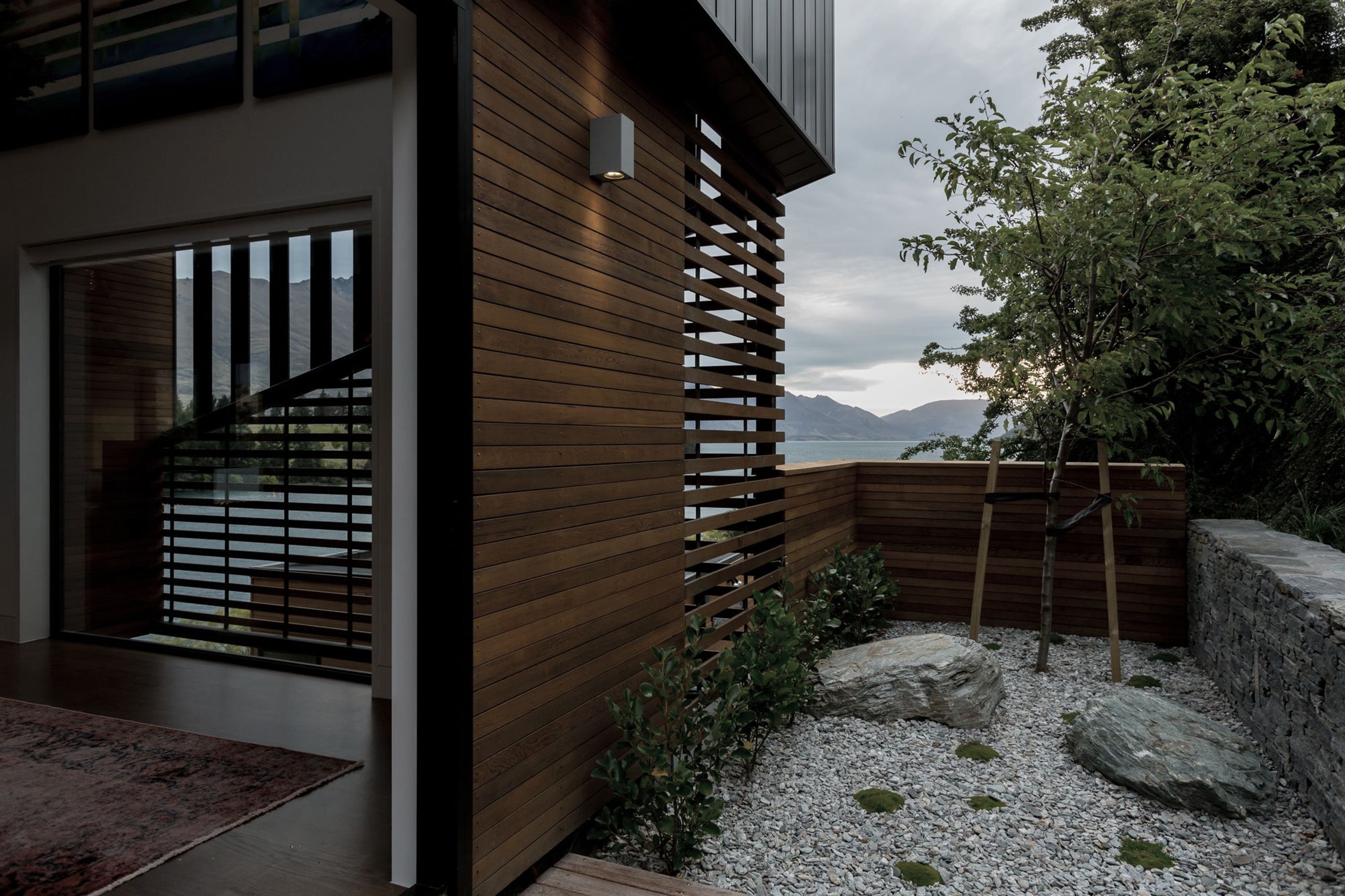 A wrap-around screen element provides visual interest as well as mitigating solar gain without completely obstructing the view.