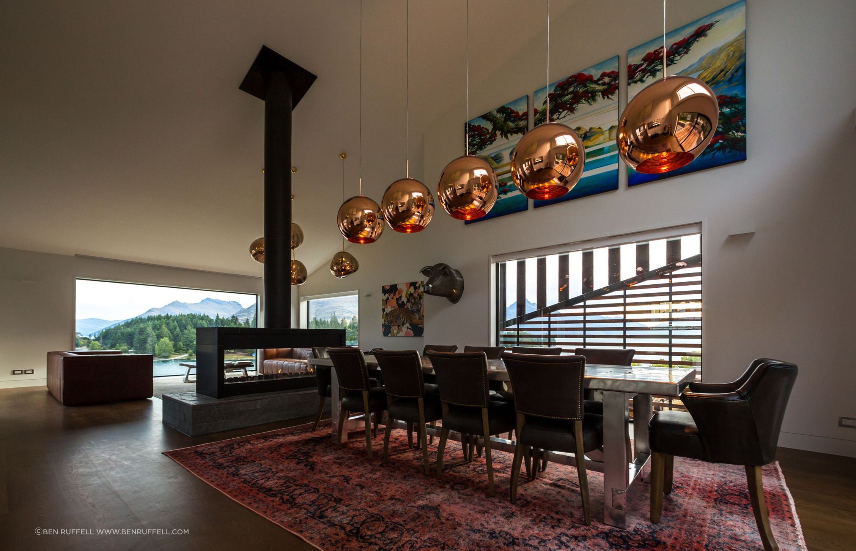The raked ceiling, open-plan footprint and large, picture windows all work in concert to produce a space of capacious volume.